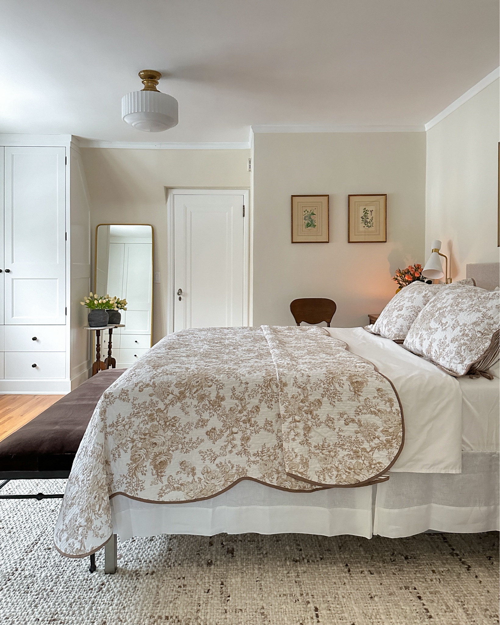 Bedroom details. Love my garden quilt + shams. *spring bedroom, bedding, bedskirt, flush mount lighting, iron bench, rug, bed sheets, cabinet hardware, sconces, faux tulips, vase

#LTKhome #LTKsalealert