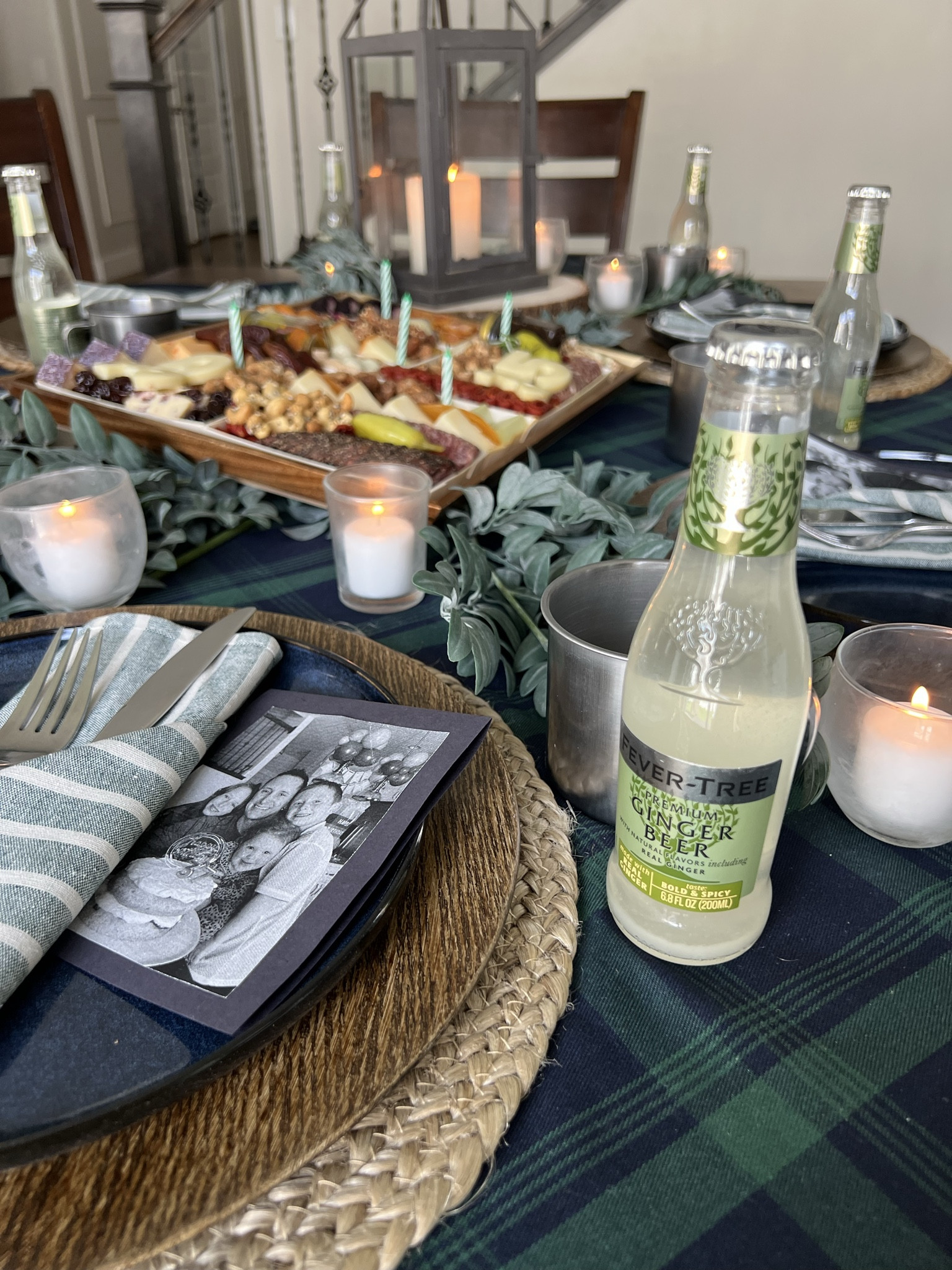Place setting for my husband's mountain-themed birthday table. featuring fever-tree drinks and tin mugs, layers of outdoor-inspired textures, mood lighting with lanterns and candles, and a picnic charcuterie dinner. See my other posts for more of this setup!  

 #LTKfoodie #LTKHome #LTKMens