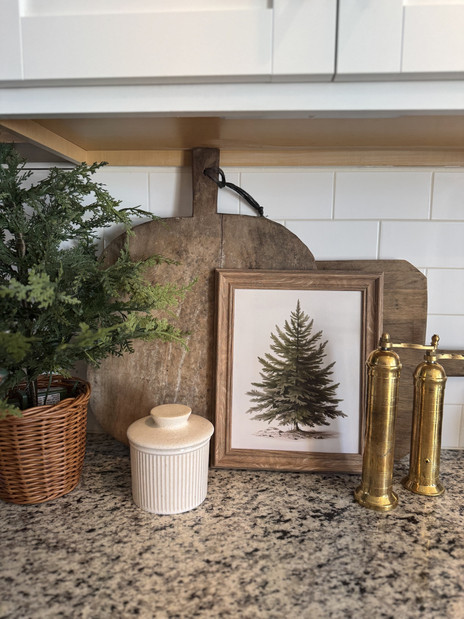Kitchen counter Christmas styling, Christmas tree art, gold salt and pepper mills, grinders, butter bell, antique bread board 

#LTKSeasonal #LTKHoliday #LTKHome