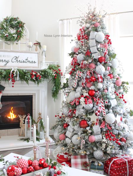 Every year I decorate a few Christmas trees in traditional red and green Christmas colors. Last year I used some of the same greenery, sprays, and stems, on both my tree and mantle so they would compliment each other. 

Christmas decorations 
Christmas decorating ideas
Christmas living room
Traditional Christmas colors
Holiday decor
Holiday magic
Seasonal decorating ideas 
Oh Christmas tree
Christmas ribbon

#LTKhome #LTKSeasonal #LTKHoliday