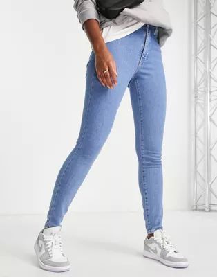 Tommy Jeans sylvia high rise super skinny jean in mid wash | ASOS (Global)