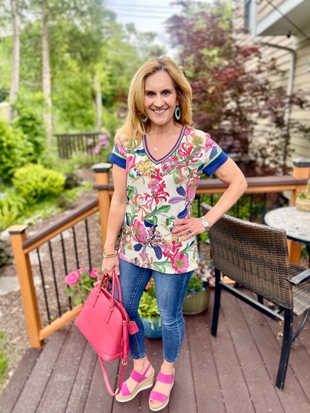 Unveiling my flowering planters in this gorgeous floral tee.  🌺🌿🌼🌸  I added my new pink Prada bag for good measure. 💕  

#LTKItBag #LTKStyleTip #LTKOver40