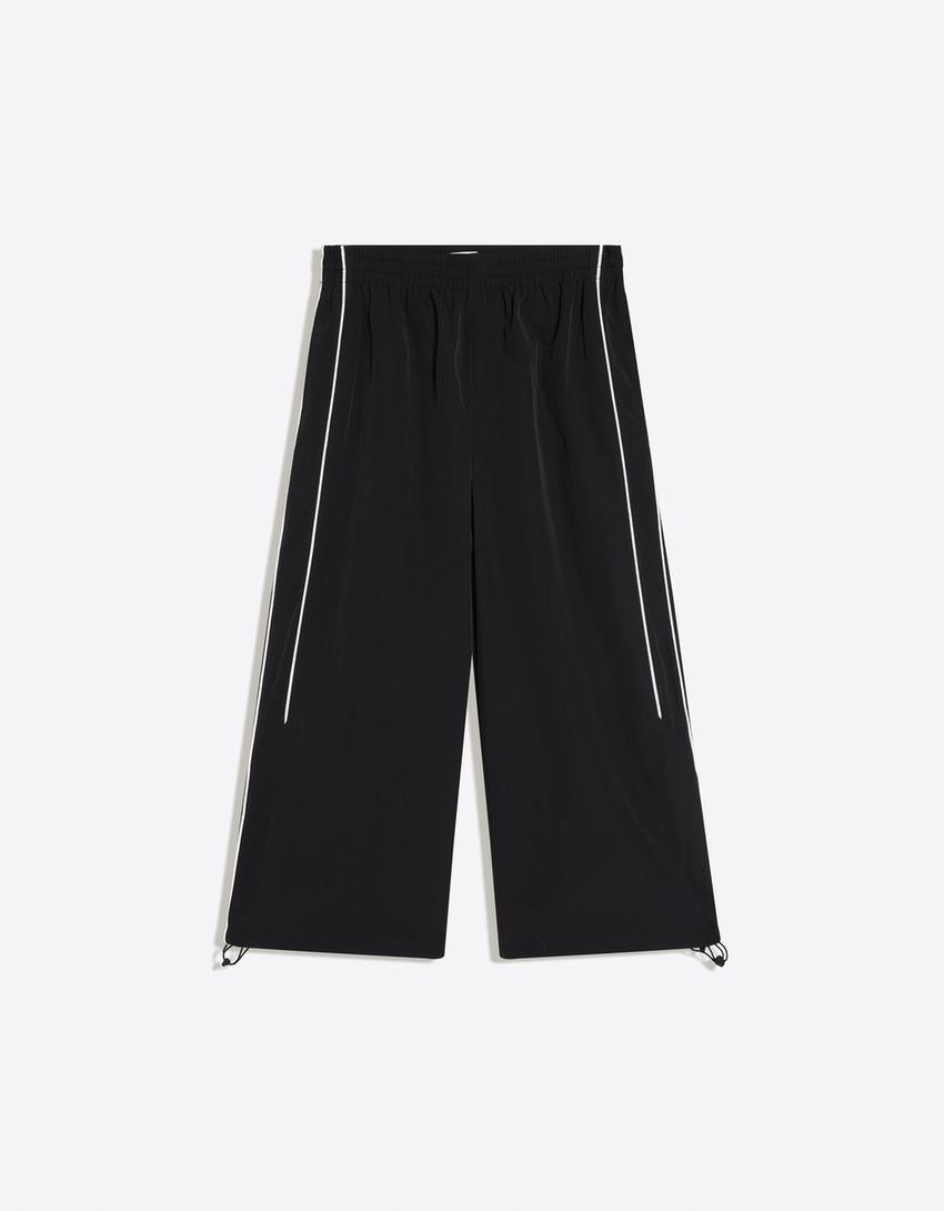 Technical capri trousers with stoppers - Trousers - Women | Bershka UK