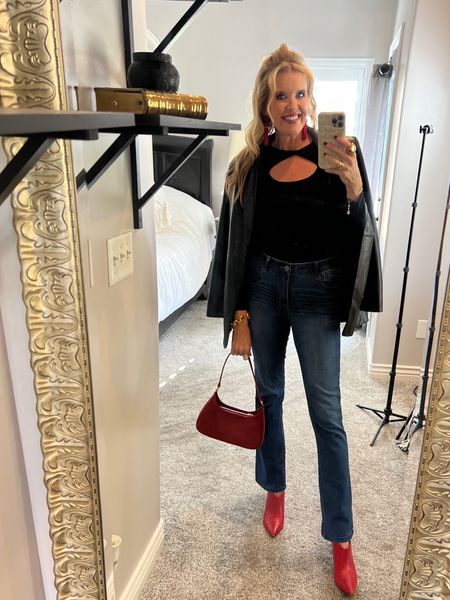 Date night /holiday edition

Pumiey body suit
Wit wisdom jeans size down 
Chicos leather blazer
Laudi bindi handmade bag
Red booties
Red tassel earrings 
Buxom lip gloss Champagne 
Lip stick is Ysl  
Julie box gold jewelry 

#LTKHoliday #LTKitbag #LTKstyletip