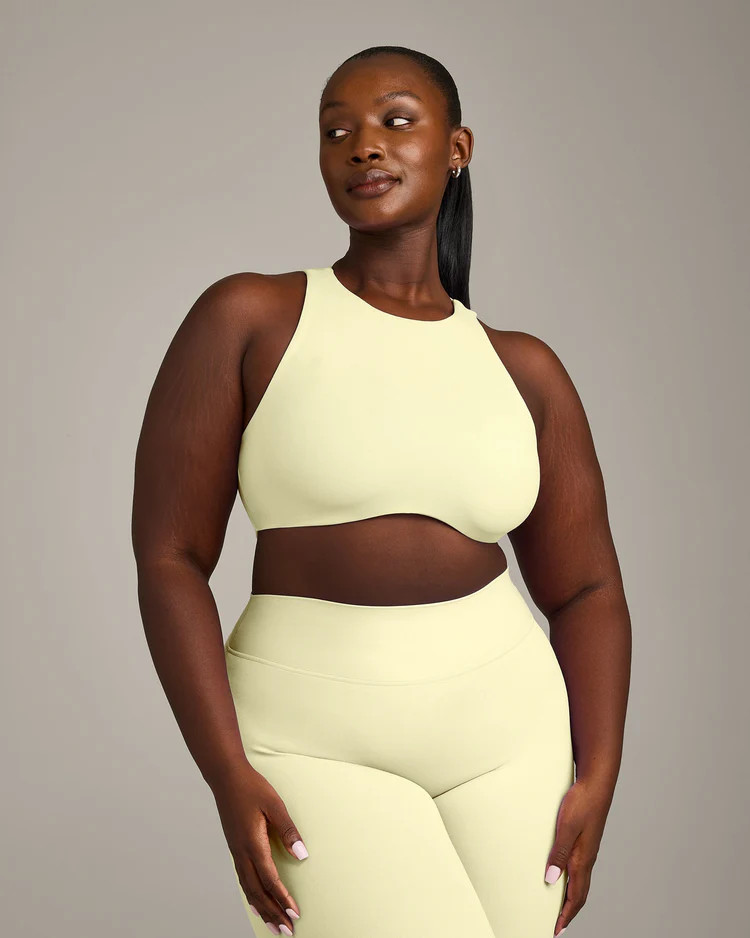 SoftMotion™ High Neck Sports Bra with Gray Logo 
 Pastel Yellow | Oner Active (UK / US)
