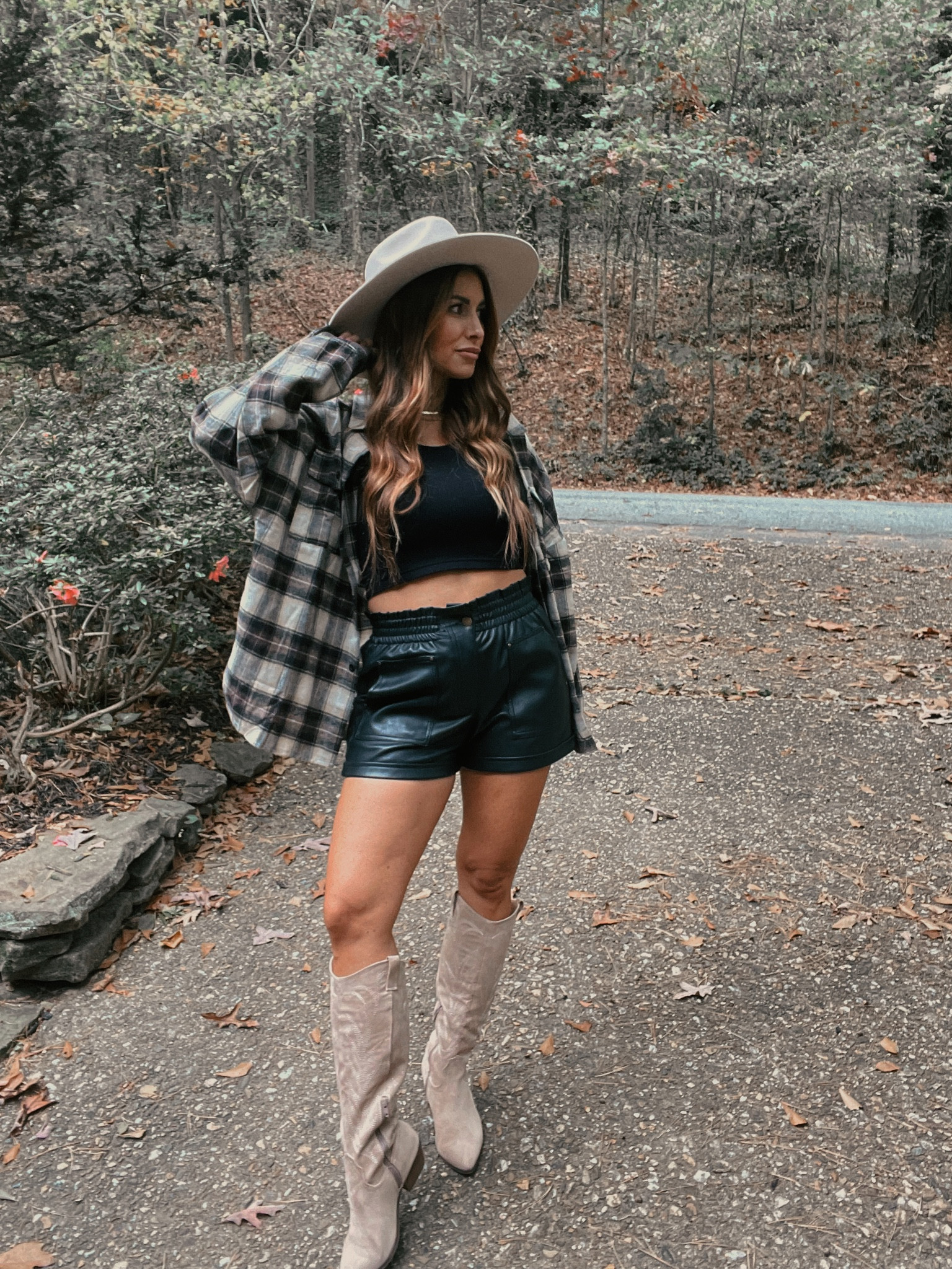 Plaid flannel shirt, faux leather shorts, cowboy boots, hat  

#LTKHoliday #LTKshoecrush #LTKSeasonal