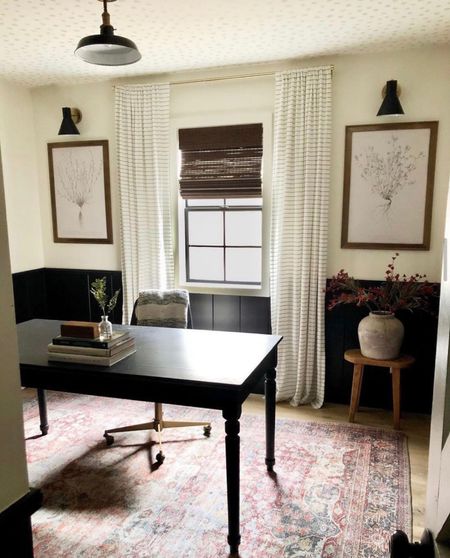 Area rug, striped curtains, Roman shades, wooden woven shade, black sconce, ceiling light, flush light, desk, desk chair, art print, office decor, office furniture 

#LTKhome