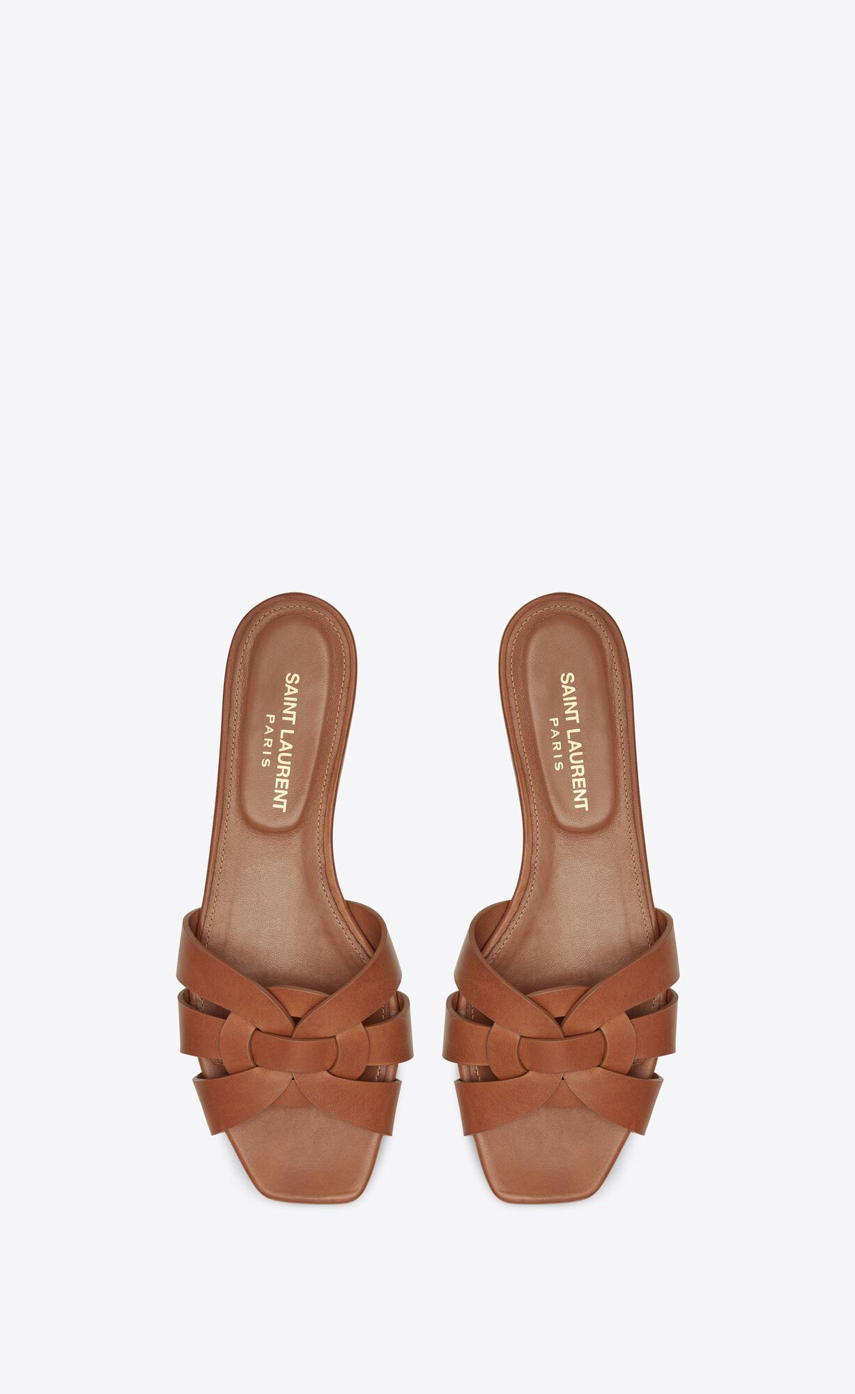 slide sandals made with metal-free tanned leather with intertwining straps. we recommend selectin... | Saint Laurent Inc. (Global)