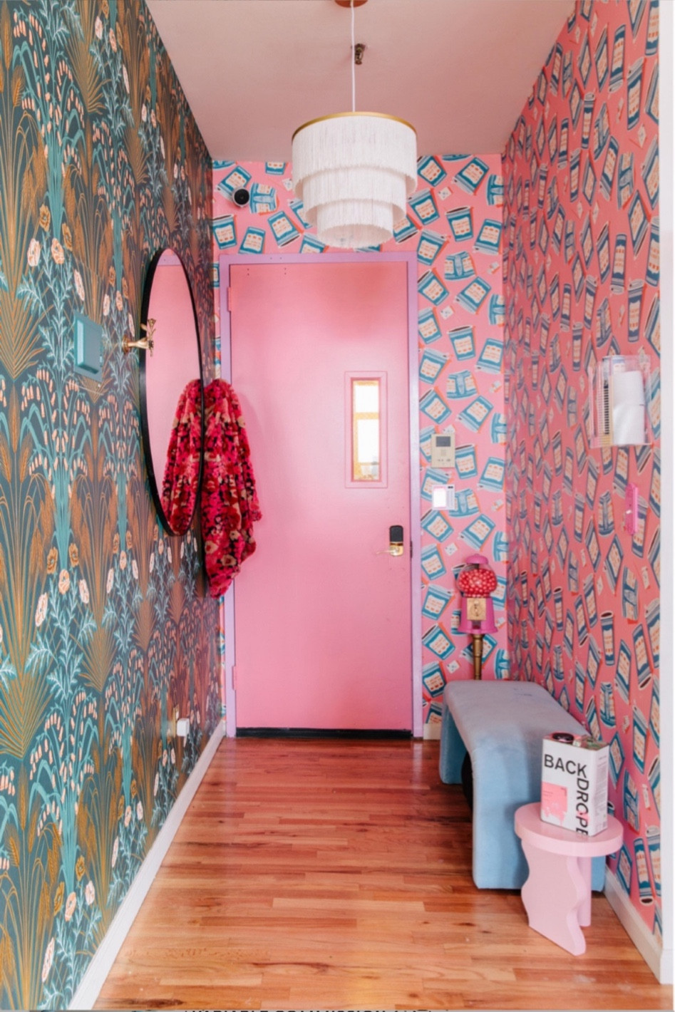 Colorful home entry pink front door apartment wallpaper mixing wallpaper prints pink entryway furniture 

#LTKHome