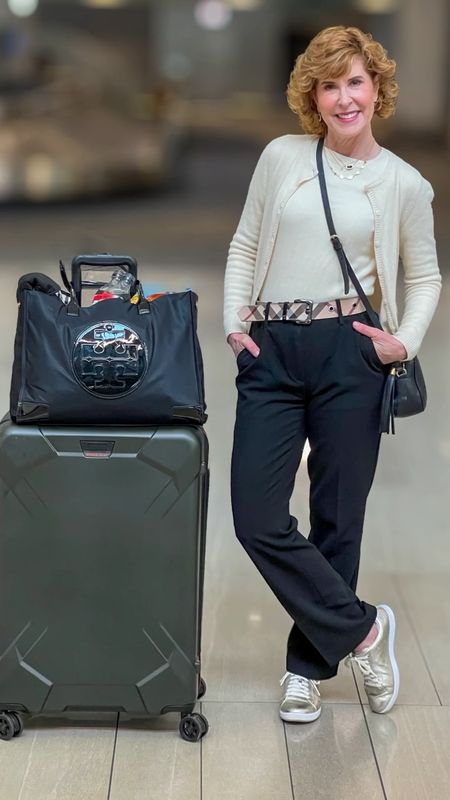 My travel look is an ivory cashmere twin set, black pants, gold sneakers and a Burberry belt. My luggage is Briggs & Riley, with a Tory Burch travel tote.

#LTKstyletip #LTKtravel #LTKVideo
