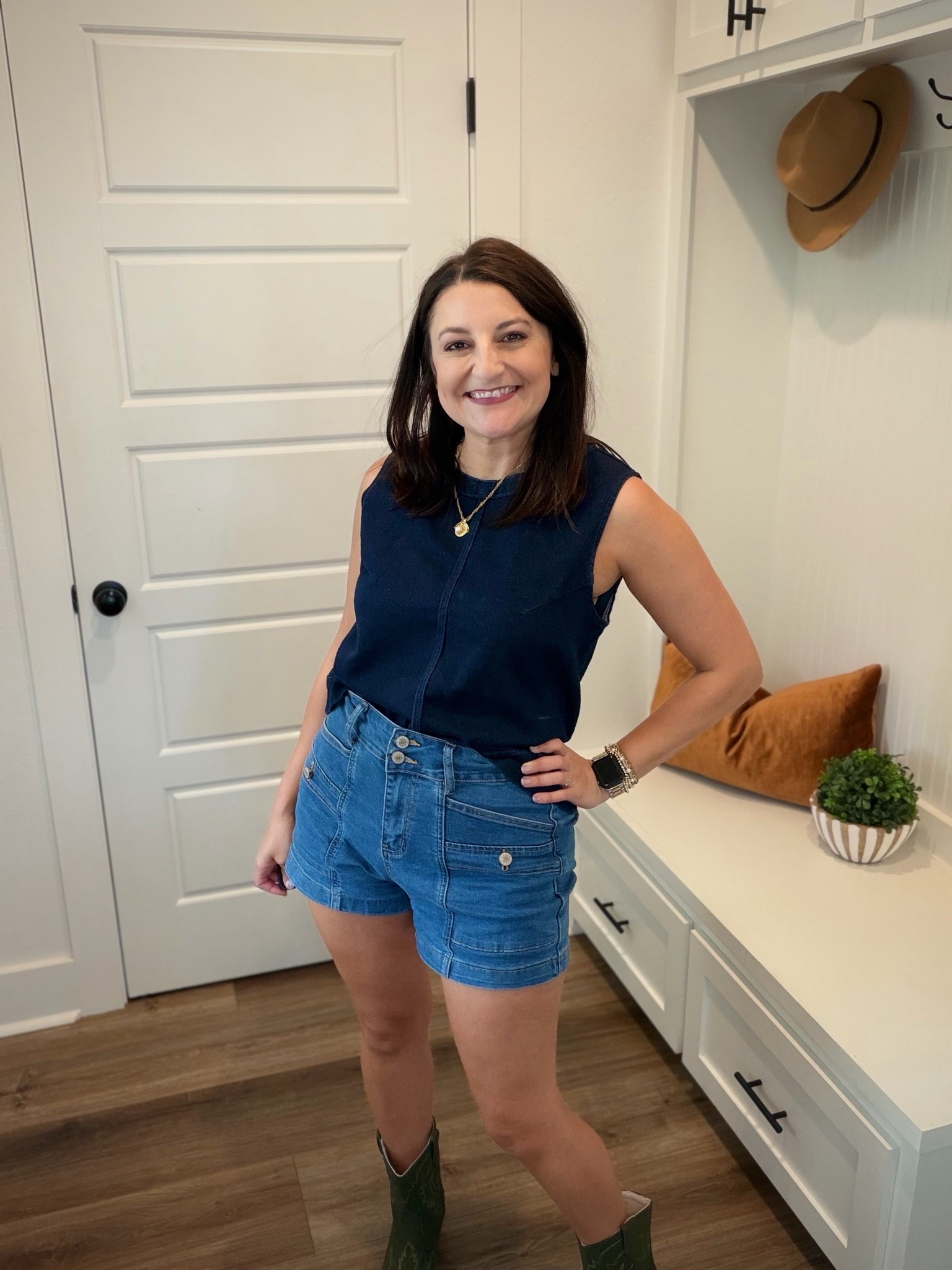 Wearing a Medium Top in the color Navy. Size 8 in shorts, could use a 6!