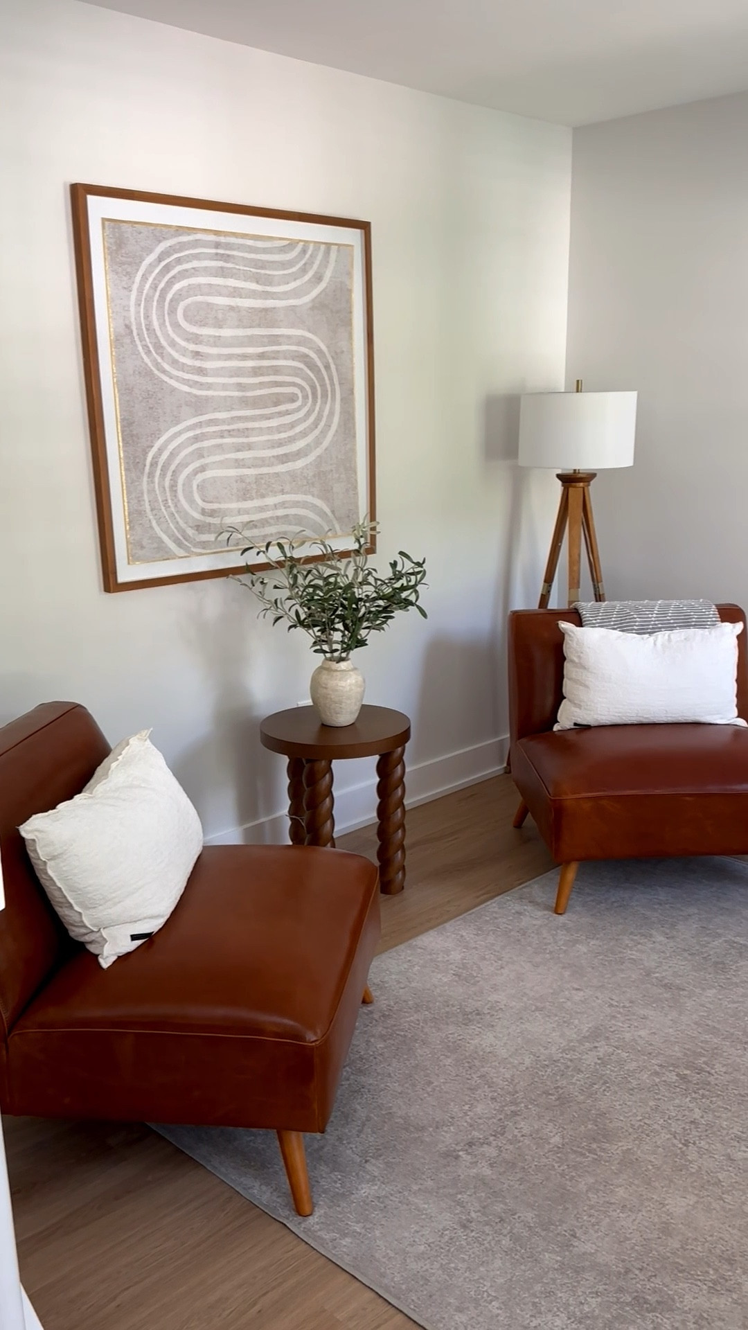 World Market Huxley cognac mid century modern armless chair 

Target Threshold oak wood tripod floor lamp dark brown

Target Studio McGee faux Shady Lady tree in ceramic 

Target braided accent table in walnut - Threshold designed with Studio McGee. This table is gorgeous and is perfect for a corner or used as an accent piece😍

Target olive leaf potted arrangement - Threshold designed with Studio McGee

Ruggable Serenta ash grey area rug in 5x7. Definitely need a bigger and lighter rug for this room and more decor🙈

Abstract wall art, wall decor, modern accent chairs, area rug, home decor, faux plant, faux tree, Corner table, accent table, braided table, walnut table, olive tree, olive plant, modern room, modern furniture, modern decor, living room, living room furniture 

#LTKStyleTip #LTKSaleAlert #LTKHome