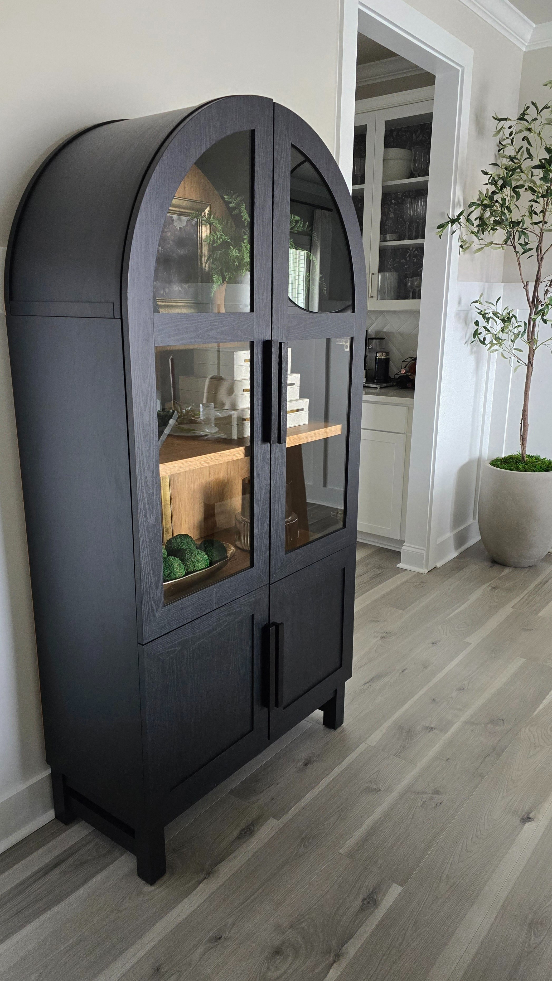 The Better Homes and Gardens Juliet arched cabinet. Definitely a little troublesome trying to get the doors to all line up, mine are still off by at least a quarter inch. Going to replace the handles with gold pulls.Better Homes and Gardens, arch cabinet, Walmart home, Walmart furniture, Walmart cabinet, Juliet cabinet

#LTKhome #LTKstyletip