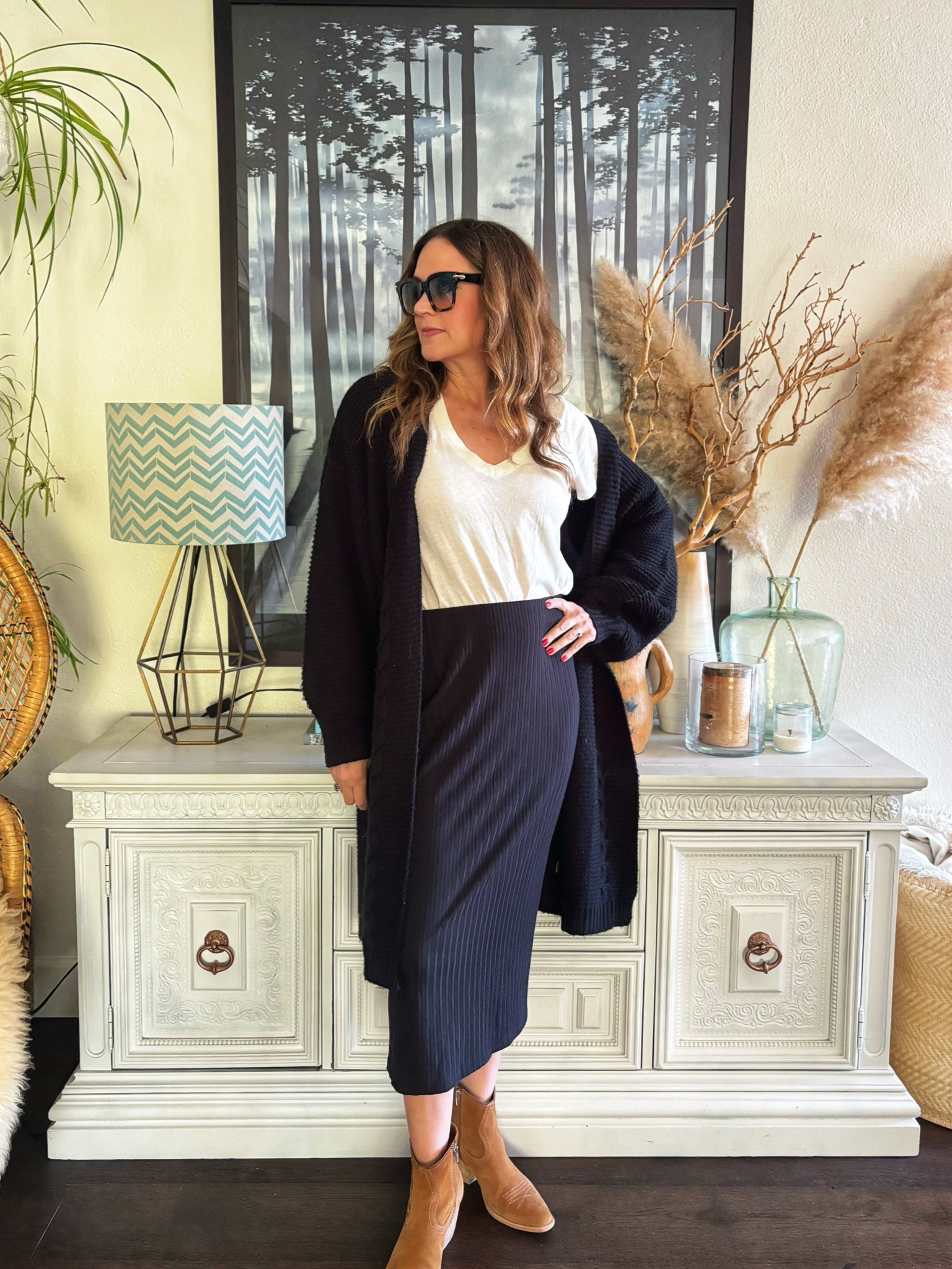 When I tagged this midi skirt I found out it was actually maternity 🤦‍♀️ but hey who cares!  It is stretchy and comfortable and it can be dressed up (with a blazer) or down like I did here with a v neck and slouchy sweater.  