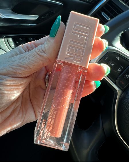 Pictures do not do this lip gloss justice. It is the perfect pouty sheer pink gloss with hydraulic moisturizer and it’s non-sticky, even tastes and smells good! Just a hint of shimmer makes this a winner for your spring to summer look. #kiss #affordablemakeup #easymakeup #over40 Hey there everyone! I just had to share my excitement about the Maybelline Lifter Lip Gloss in the shade Moon! This budget-friendly makeup gem is the perfect pouty sheer pink color for spring and summer to complete all your looks.

What's great about this lip gloss is that it's easy to swipe on for a light, everyday moisturizing look that also provides a subtle shimmer. And at under $10, it's a fantastic deal for such a high-quality product.

The Maybelline Lifter Lip Gloss in Moon is perfect for achieving a sun-kissed, golden hour look that enhances your lips with a glossy, plumped appearance. It's infused with hyaluronic acid, making it ultra-hydrating and giving your lips a smooth, non-sticky finish.

This shade is flattering on all skin tones, and it's the perfect addition to complete any spring or summer look. Whether you're running errands or headed to a special occasion, this lip gloss is a must-have in your makeup bag.



#LTKstyletip #LTKunder50 #LTKbeauty