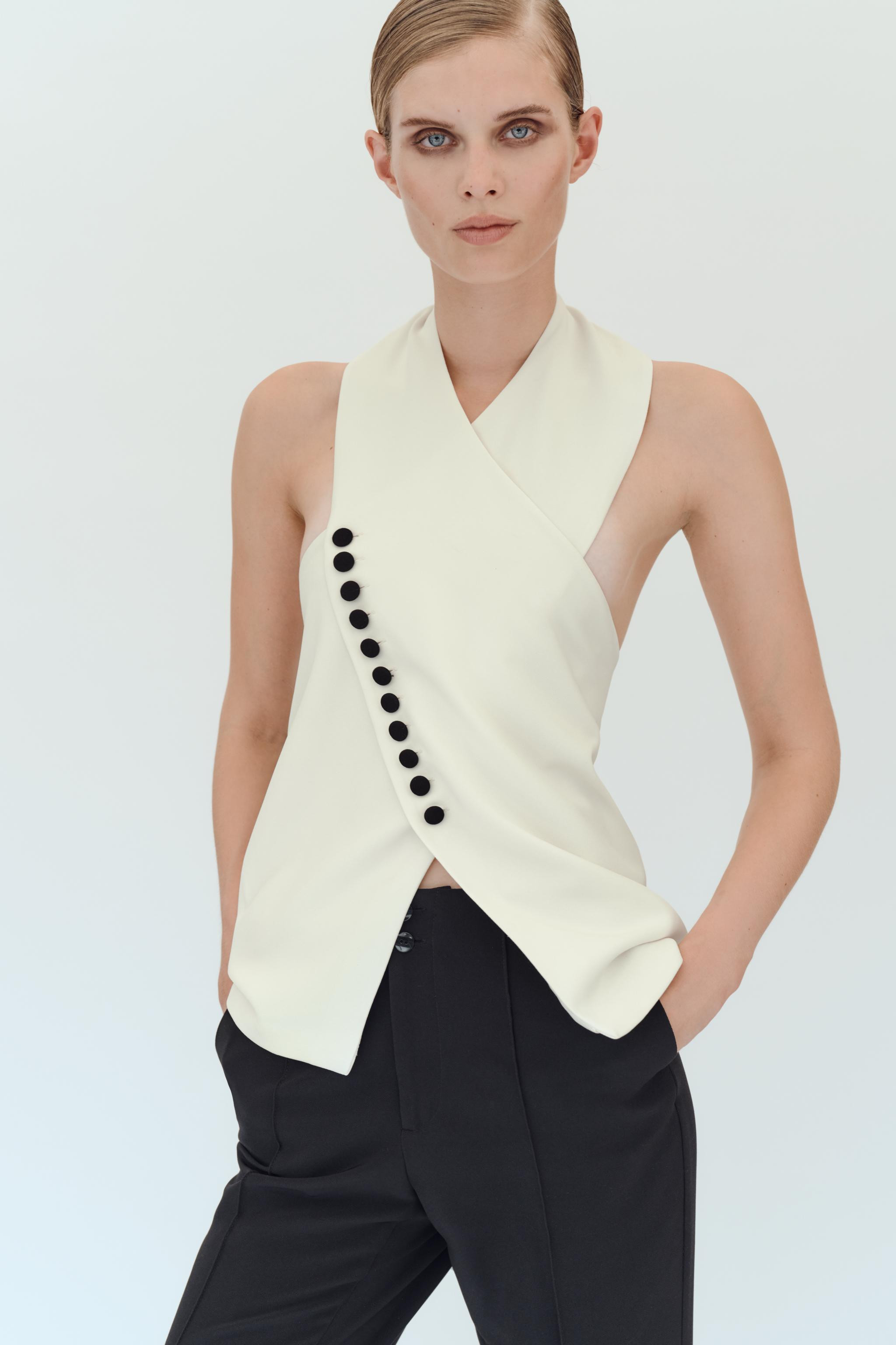 Halter neck vest with an open back. Front button closure and hidden back buttons. | Zara US