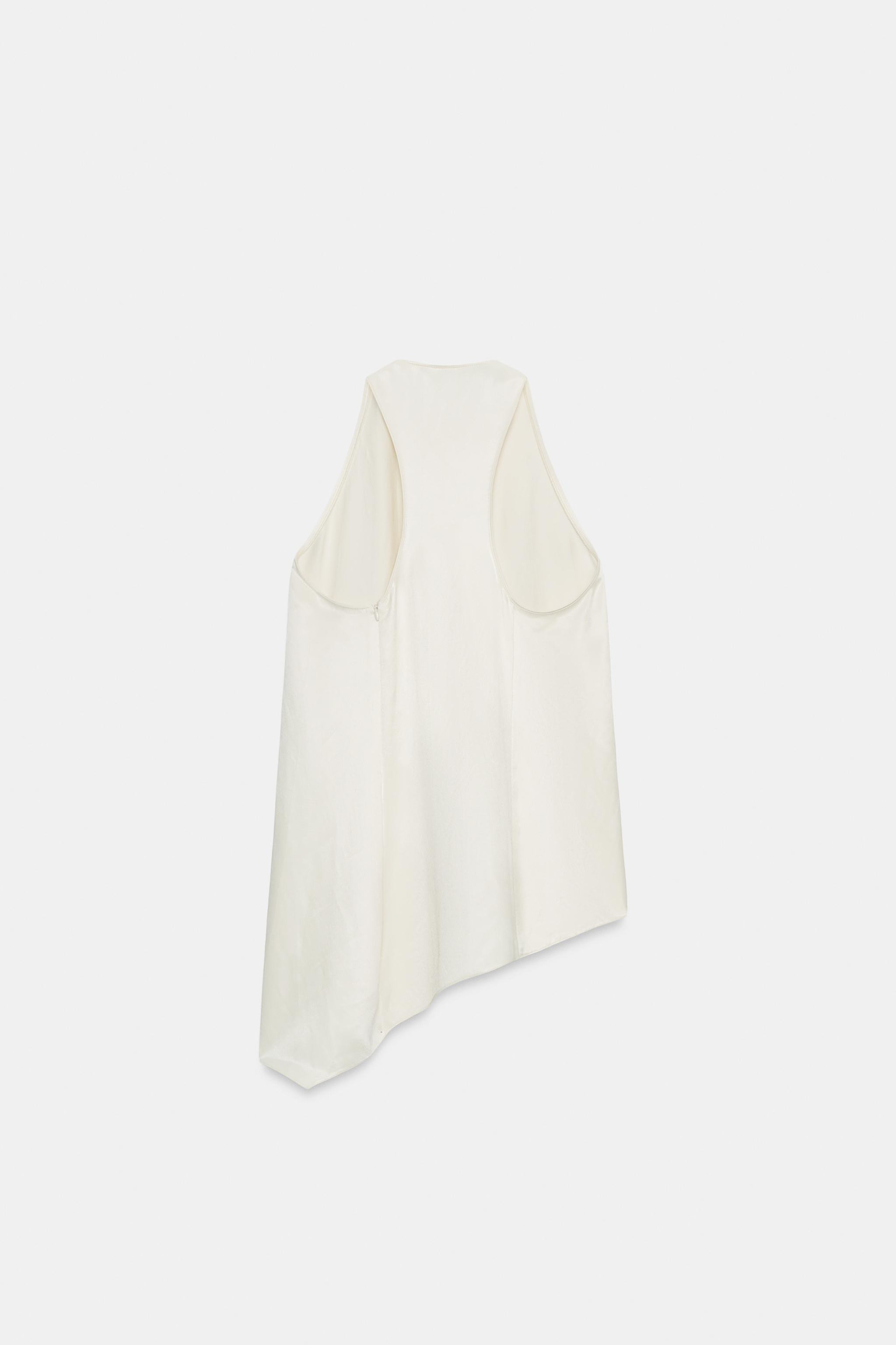 ZARA WOMAN COLLECTIONTop made from a 14% linen blend yarn. Featuring a round neck and a racerback... | Zara UK