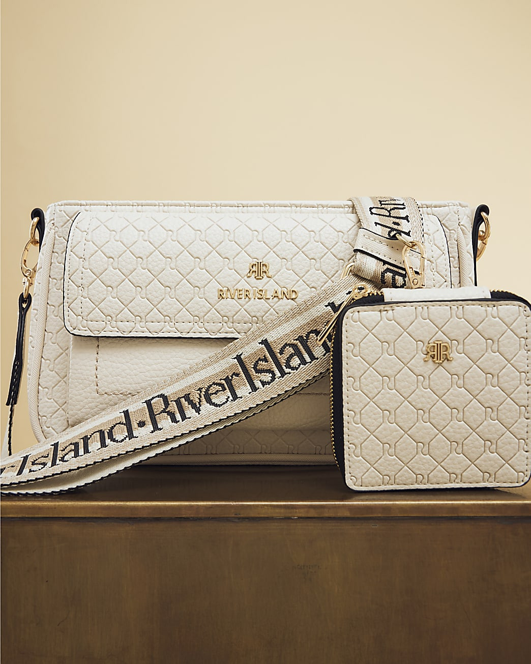 Cream RI Monogram Pouchette Cross Body Bag | River Island UK & IE