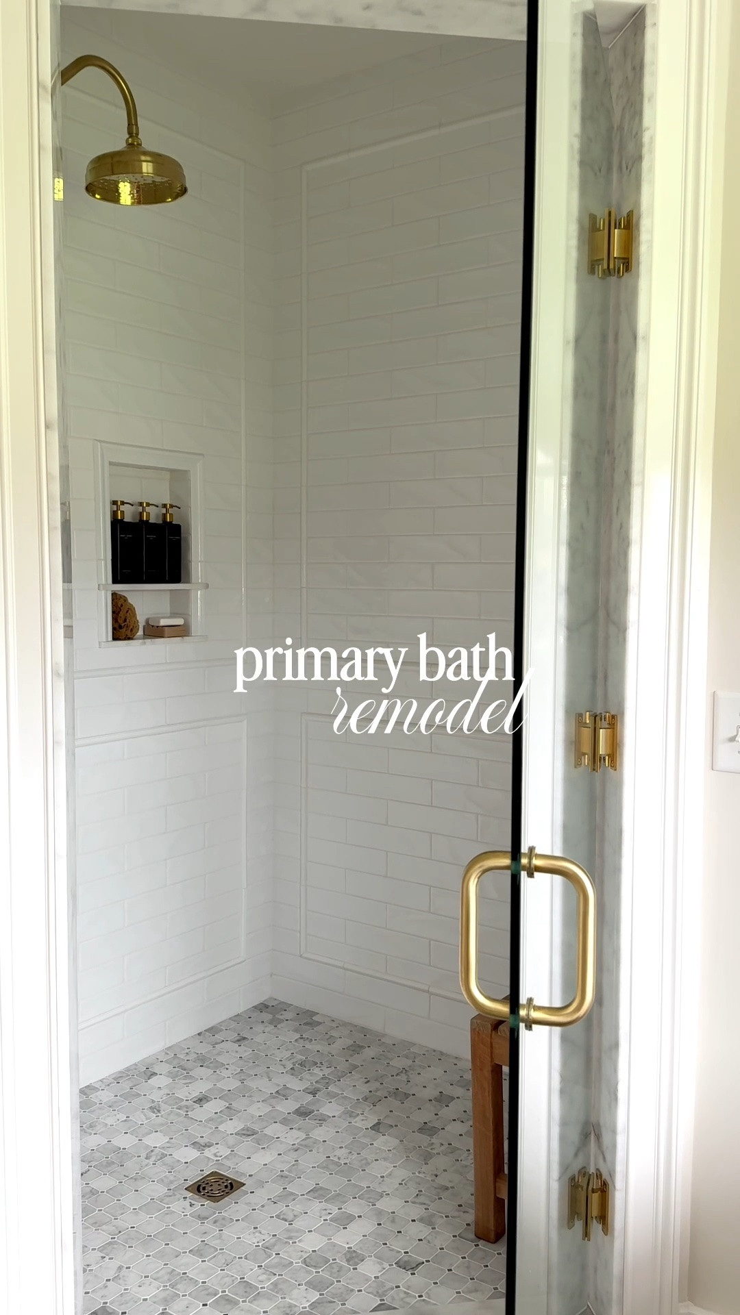 Primary bathroom remodel with brass faucets, copper tub, marble tile. Feels like a spa.