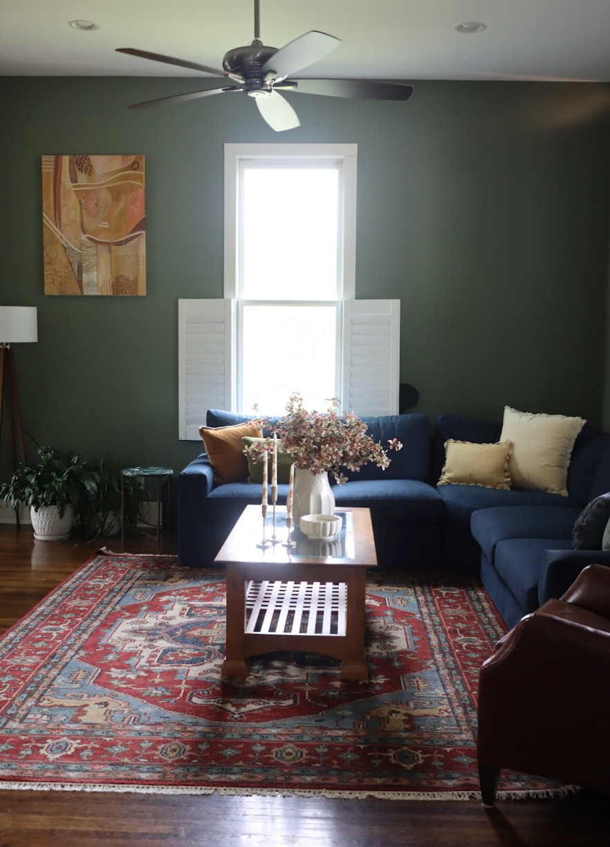 This colorful living room in one of Nashville’s historic neighborhoods is proof that personal style makes all the difference.✨ We focused on layering vibrant colors, warm wood tones, and eclectic accents to bring out the home’s charm while keeping it functional and inviting. Original architectural details were celebrated, and every choice — from furniture placement to bold artwork — was made to balance comfort, beauty, and personality. The result is a lively, timeless space that feels lived-in, expressive, and uniquely theirs.🏡🎨 

 #eclecticstyle #historicinteriors #livingroomdesign #LTKU #LTKHome #LTKFamily