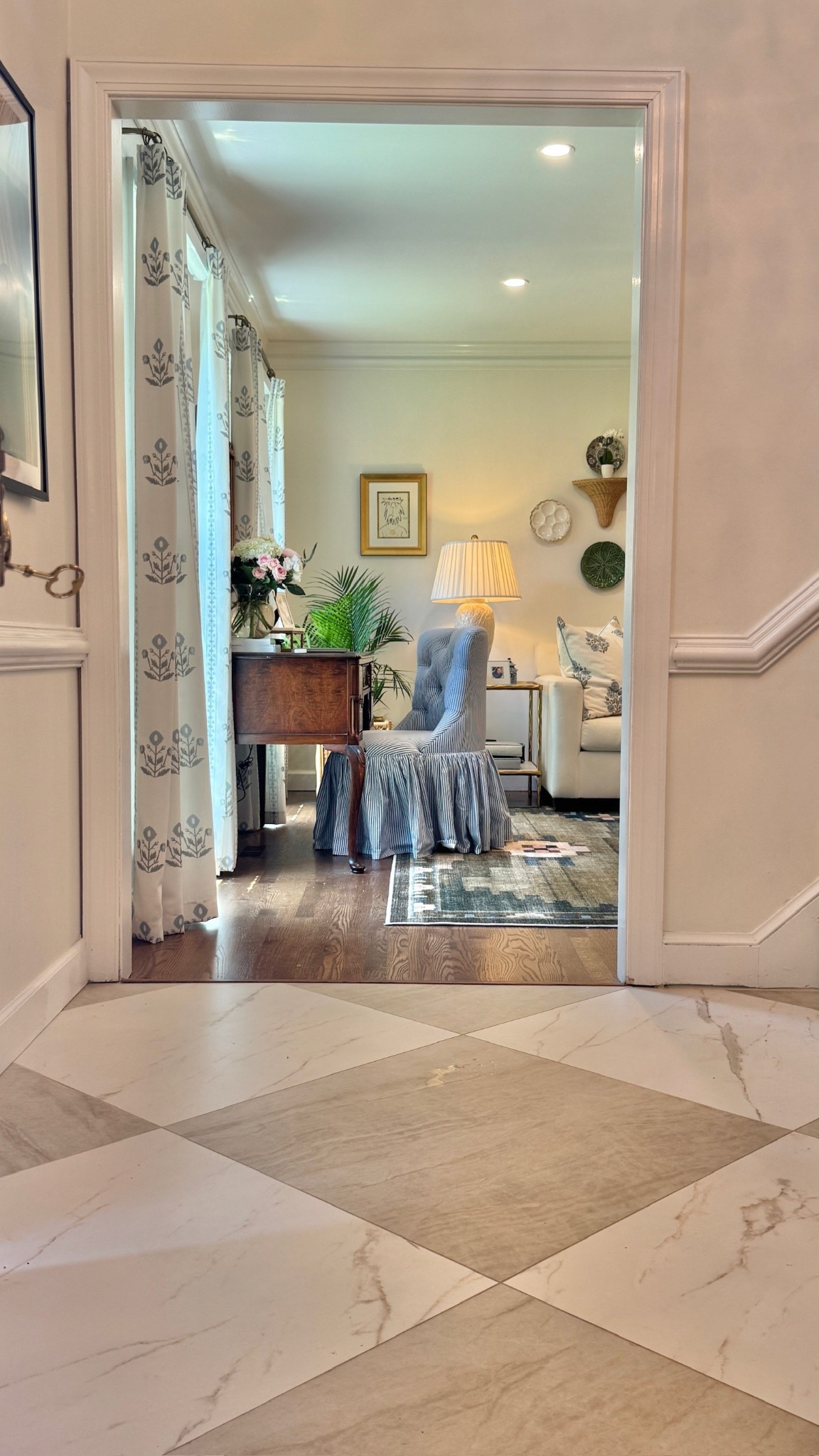 Love this little styled desk and chair. Perfect view of this corner of the living room. Blue striped chair, blue desk chair, block printed curtains, classic home, classic style, cabbage plates, checkerboard tiles

#LTKHome