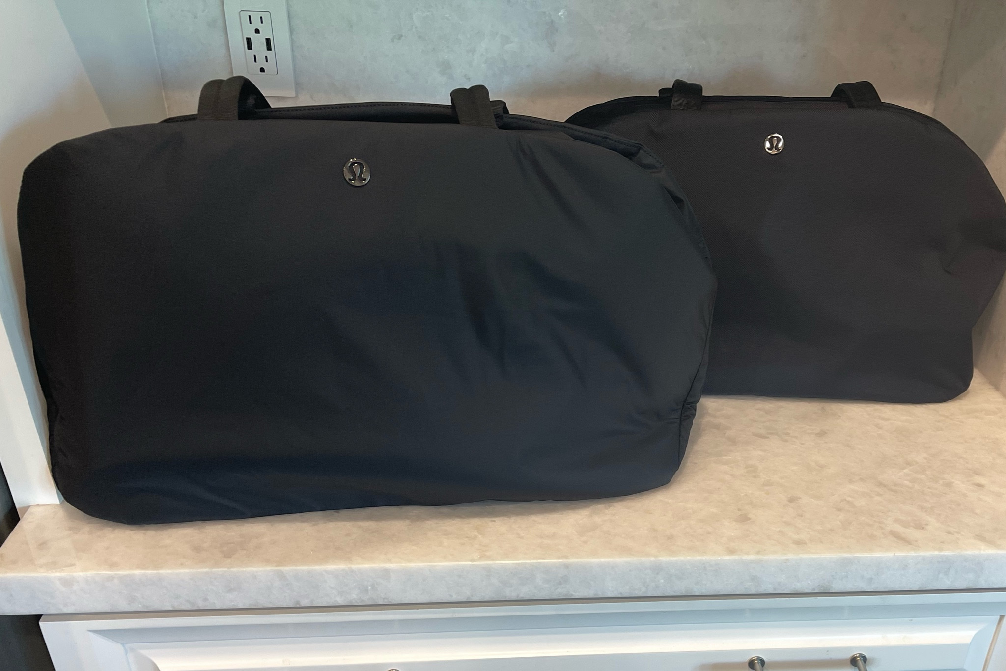 I wanted to show the size comparison between these two Lululemon bags. Personally, I like the size and the material of the larger one. If you’re looking for a weekender either of these are a great choice but if you’re not needing to use it as your personal bag on the airplane, I would recommend the larger size and it happens to be on sale right now too so the price can’t be beat!  #travel #travelbag #weekender #bestbag

#LTKsalealert #LTKitbag #LTKtravel