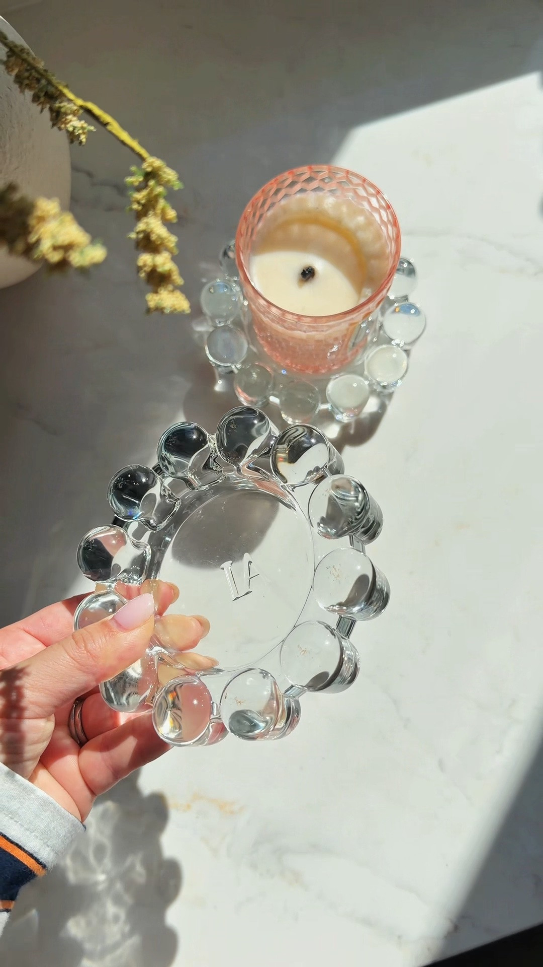 This Alice Lane Bubble Candle Dish has the prettiest beaded glass detail that elevates your coffee table, nightstand, or bathroom vanity. It comes in clear, amber, and smoke—and it’s currently on sale!

bubble candle dish, Alice Lane home decor, glass candle holder, beaded glass dish, decorative candle plate, coffee table styling, aesthetic home decor, chic candle accessories, vanity trinket dish, modern glass home accents