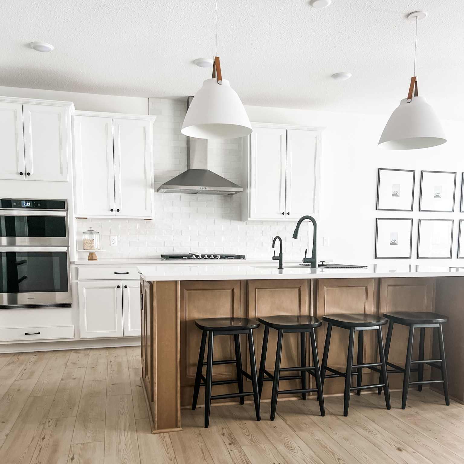 Kitchen, fridge, gallery wall, faux plants, bar stools, black, furniture, kitchen decor, dining room, pendant light, west elm, target, studio McGee, Home Depot, flooring. Scandinavian modern decor. 

#LTKunder100 #LTKunder50 #LTKhome
