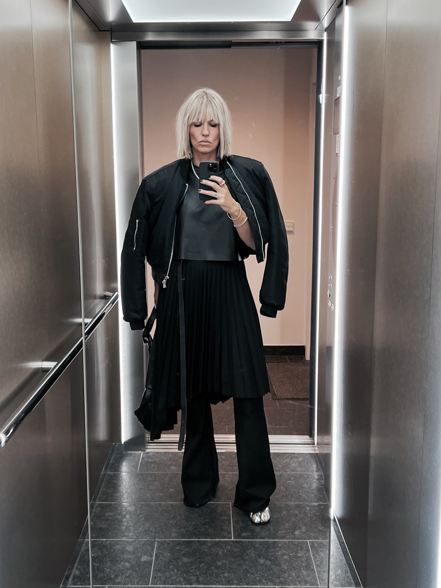 Pleated skirts are a great way to elevate your look. You can either wear it as a skirt for summer or you can style it layered over your pants or denim, to add a new silhouette to your fit. I would recommend to add a cropped top and cropped bomber to keep the bottom longer as the top! 🖤

#LTKdeutschland #LTKstyletip #LTKeurope