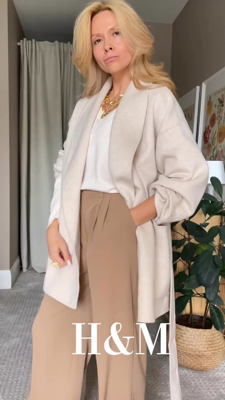 Fall 2024. 

Your outfit sounds both stylish and comfortable! The combination of the white oversized sweater with beige palazzo pants creates a chic, neutral base, while the burgundy belt adds a pop of color and sophistication. Pairing it with loafers or Adidas sneakers gives it a laid-back vibe, perfect for staying comfy throughout the day. The choice between a black or white coat is always a good dilemma, but the white coat is a great pick—it keeps the look cohesive and elegant, especially with the lighter tones in the rest of the outfit. Overall, it’s a modern, effortless look with just the right touch of color and comfort!

#LTKStyleTip #LTKWorkwear #LTKShoeCrush