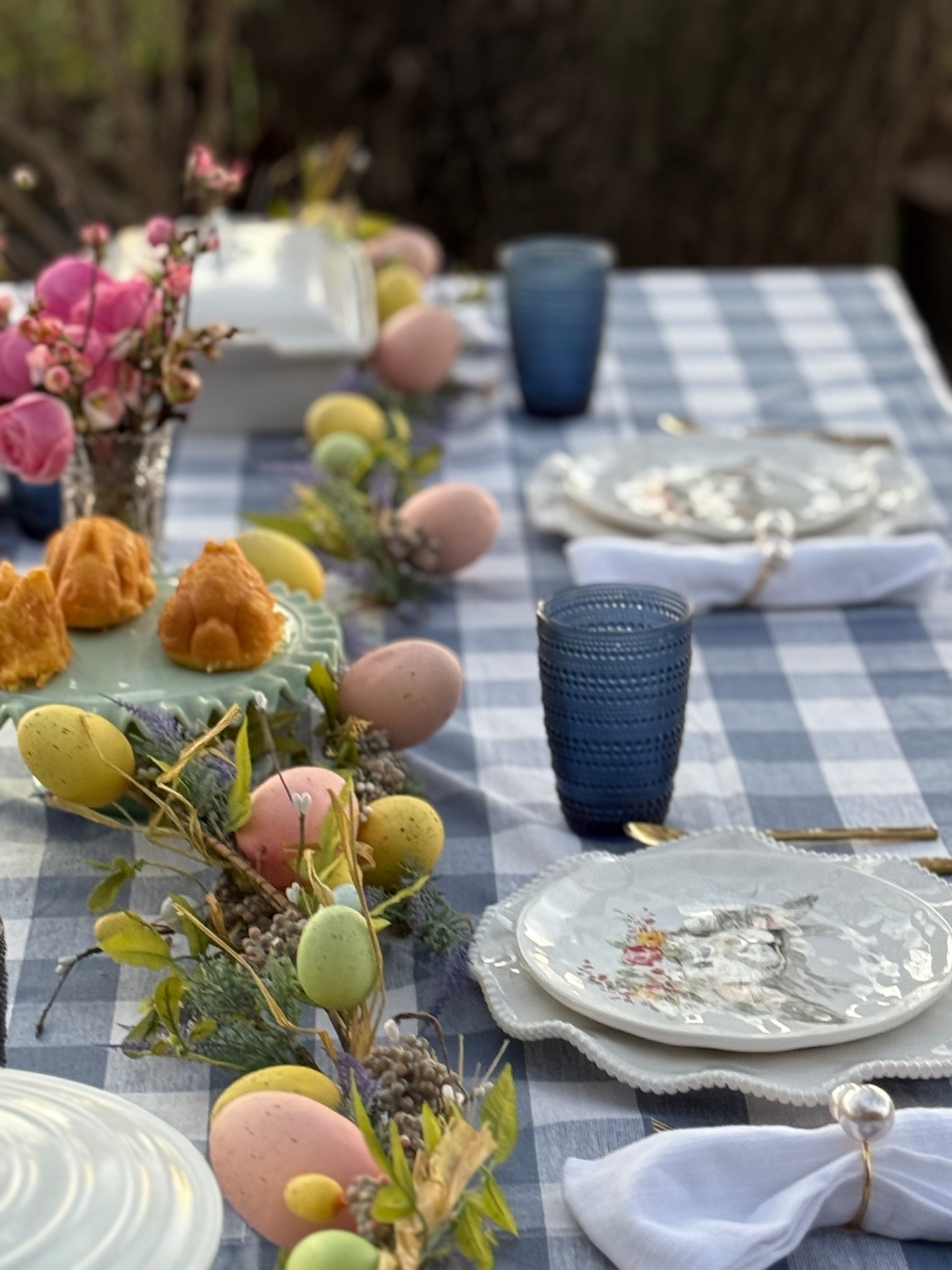 Farmhouse Easter tablescape idea. Beautiful blue and white gingham check tablecloth, Easter egg garland, adorable Easter bunny plates (with flower crowns!) and more from @wayfair! #wayfairpartner #wayfair 

#LTKSeasonal #LTKParties #LTKHome