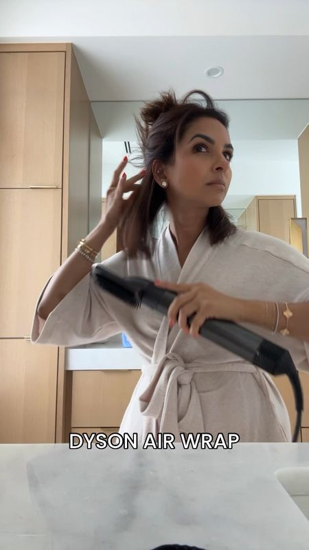 Styling my hair with my Dyson air wrap which gives me the perfect bouncy blowout and following it by curling with my GHD curling iron and setting with my favorite texture spray! All a part of the NSALE!

#LTKSaleAlert #LTKxNSale