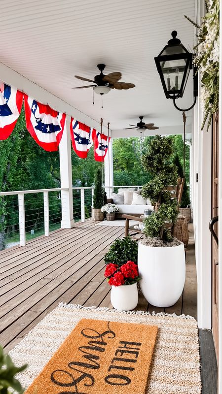 Memorial Day home decor patriotic front porch and front door decor American Americana flag bunting red faux florals geraniums hydrangeas spiral boxwood topiary trees large white planters doormats oversized double doors spring and summer decor wreaths outdoor fans lighting #LTKFind #LTKhome

#LTKHome #LTKStyleTip #LTKSeasonal