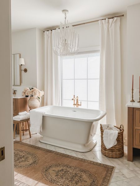 One of my favorite area in my home - this minimal primary bathroom with small swaps for the season to create a relaxing and calm space 

Bathroom refresh, light and bright, neutral style, vintage style rug, gold detail, wall sconce, faux florals, vase faves, woven basket, neutral wood tone, door knob detail, chandelier faves, tapered candle, curtain detail, gold hardware, shop the look!

#LTKStyleTip #LTKSeasonal #LTKHome