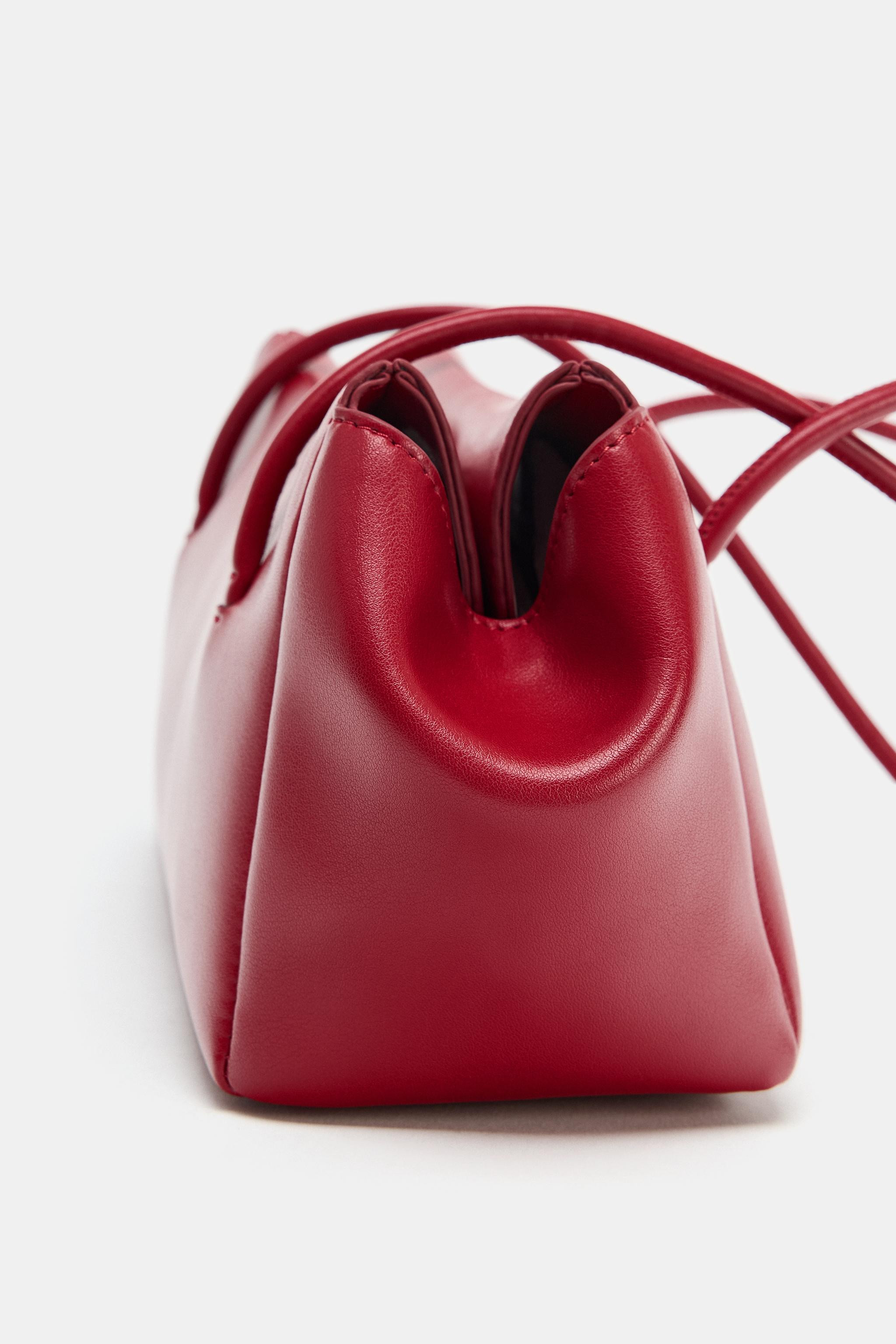 Model height: 178 cmElongated shoulder bag. Double shoulder strap. Inside zip pocket. Magnetic cl... | Zara UK