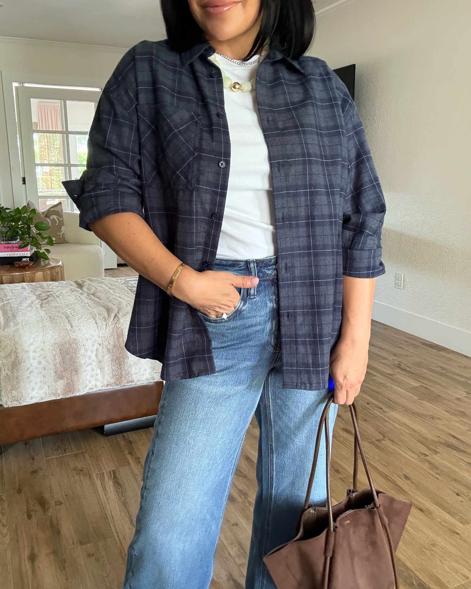 This flannel is super inexpensive and goes perfectly in your fall wardrobe. ￼