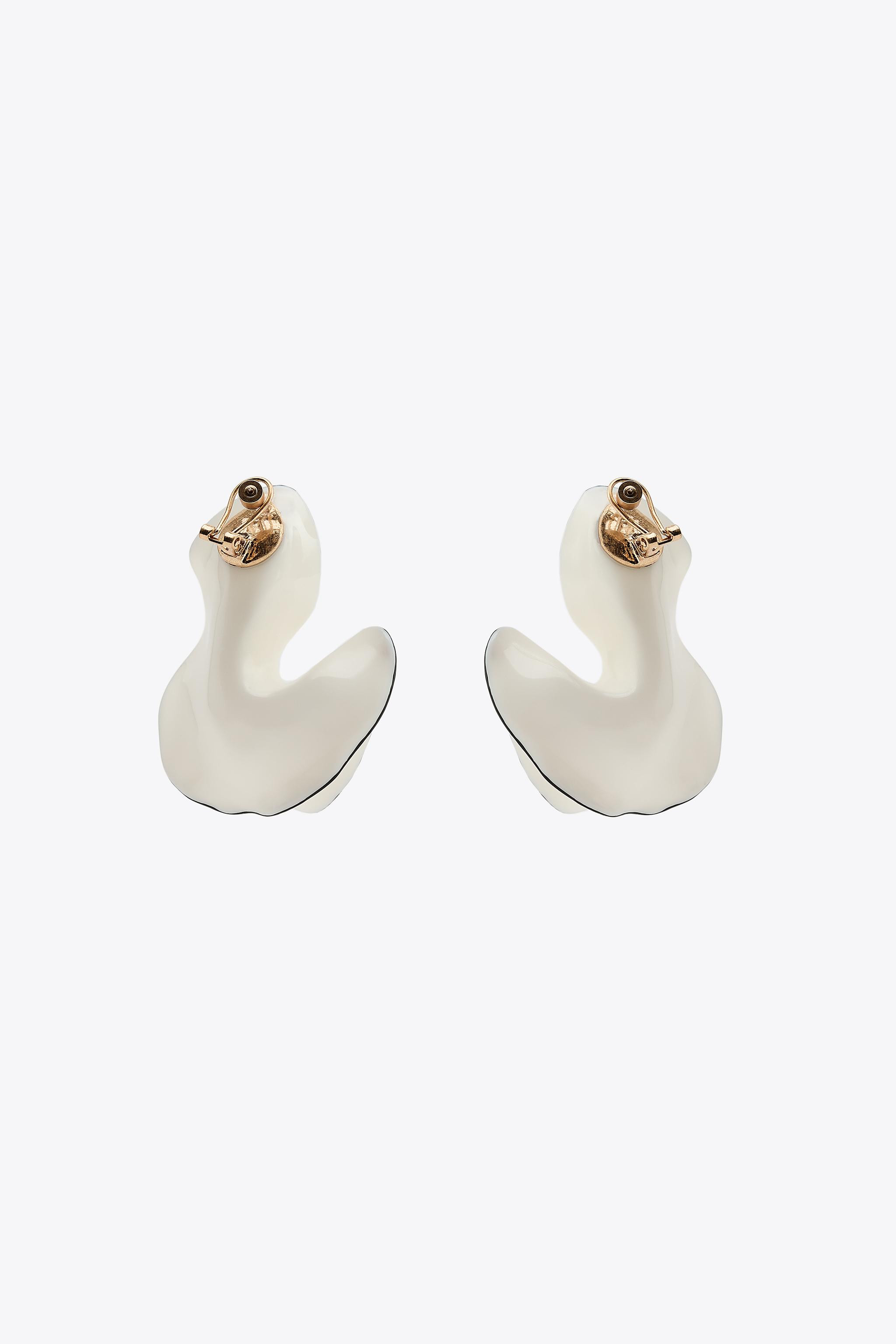 Fan-shaped earrings made of mixed resin. Detail of finishes with contrasting band. Butterfly clip... | Zara US