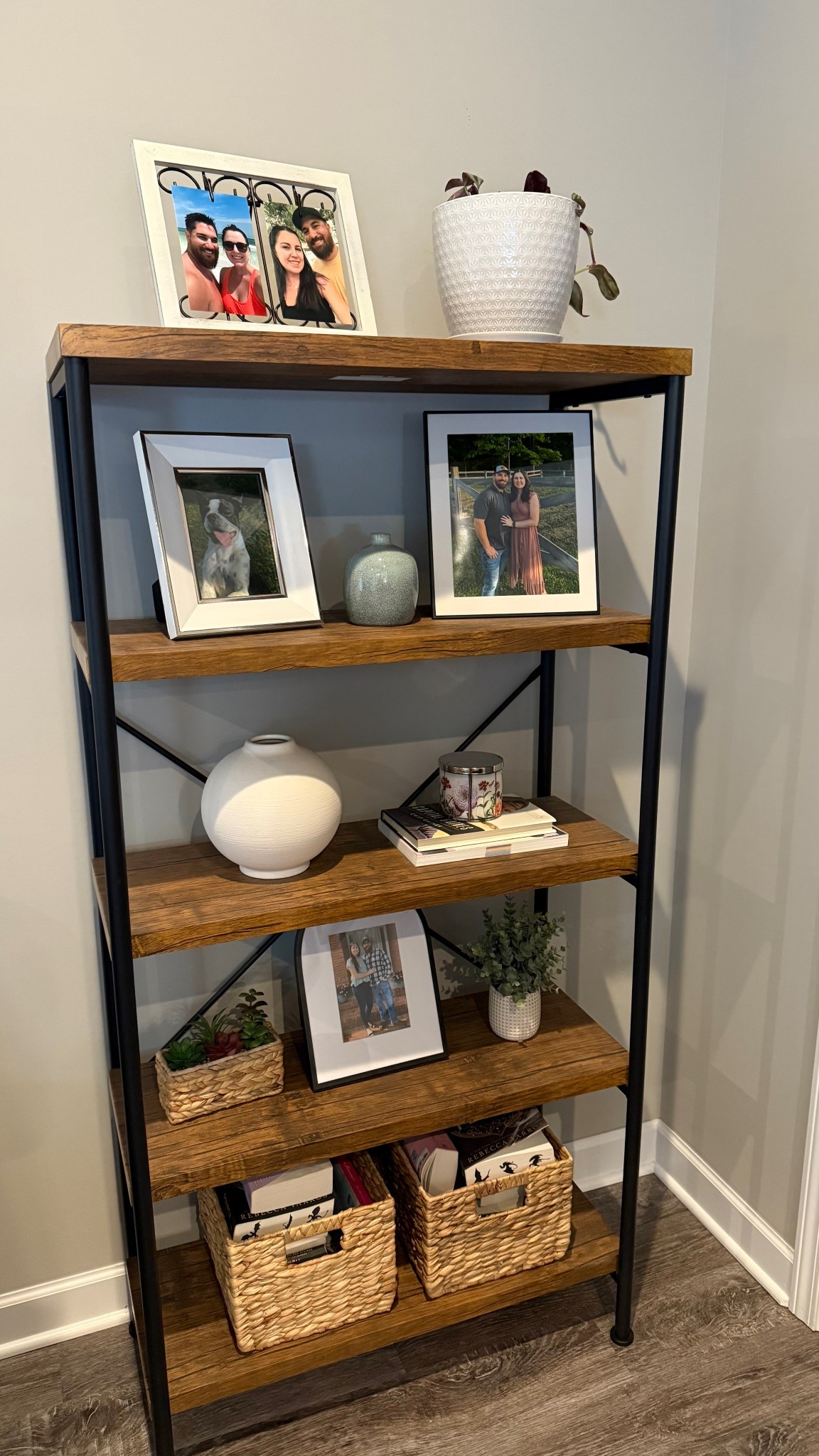 My favorite part of our living room! Rustic bookshelf with modern touches filled with pictures of my husband and me and other cute items!
Picture frames, vases, candles, baskets, coffee table books

#LTKHome
