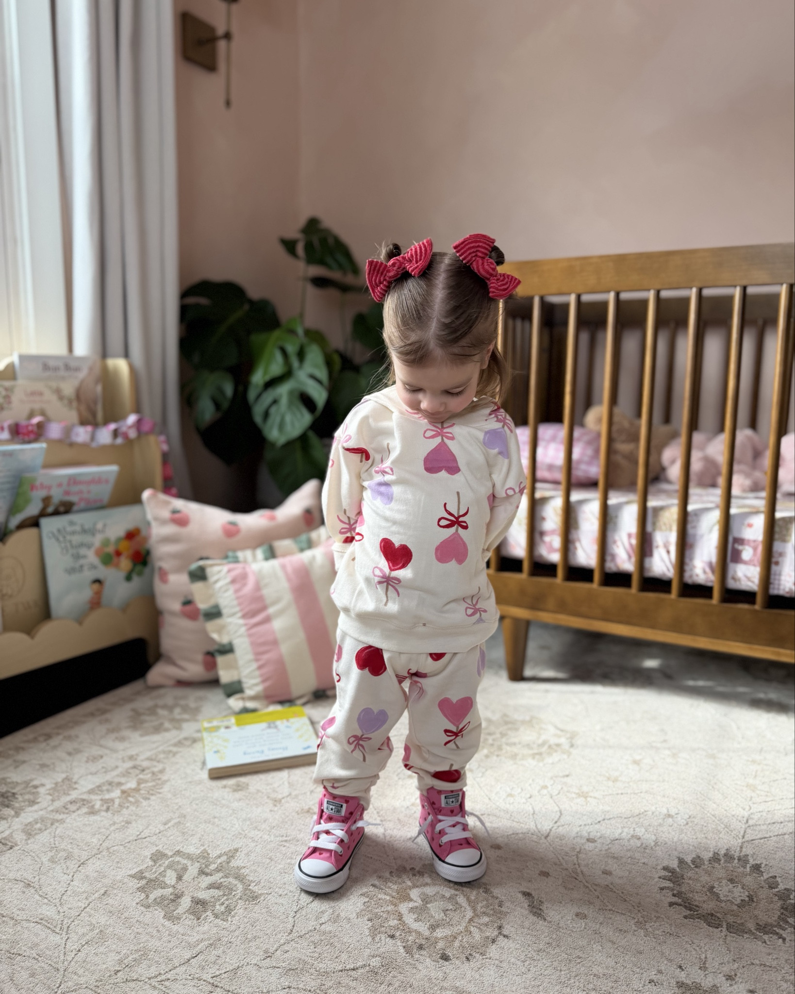 Little ham in her valentines set 🩷❤️ this is the cutest little lounge outfit!! Sis is in size 2T, pants are super long but I rolled them and it worked great! So affordable and cute — can wear the pieces separately or together 🥰

Walmart kids, Valentine’s Day outfits for toddlers, toddler girl outfits, heart sneakers, valentines shoes 

#LTKKids #LTKmomlife #LTKValentine