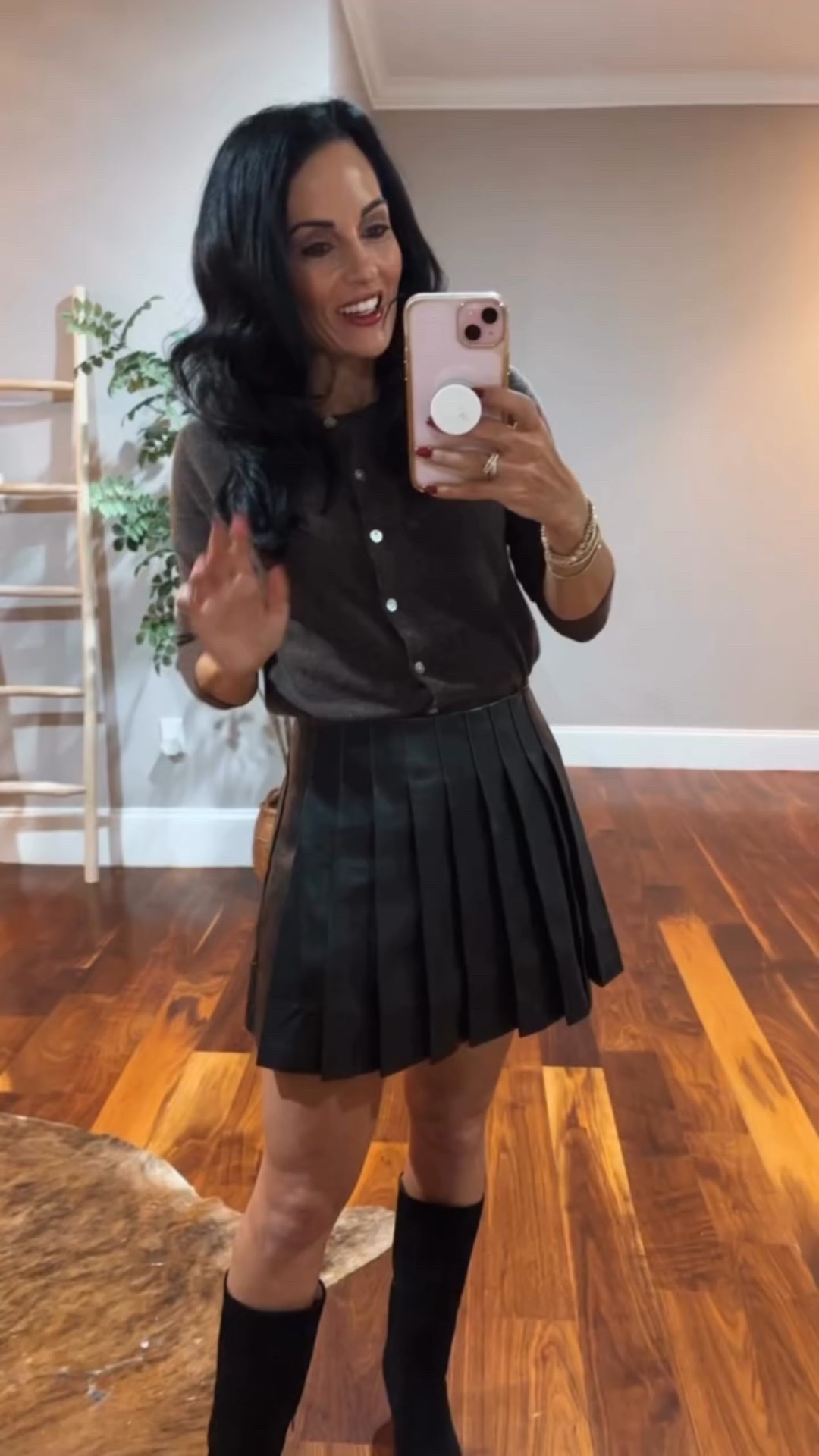 Mongolian cashmere cardigan paired with a pleated faux leather skirt and knee boots
Code laura15 on the boots 
Code laurap30 at Vici 

#LTKFindsUnder100 #LTKHoliday #LTKSaleAlert