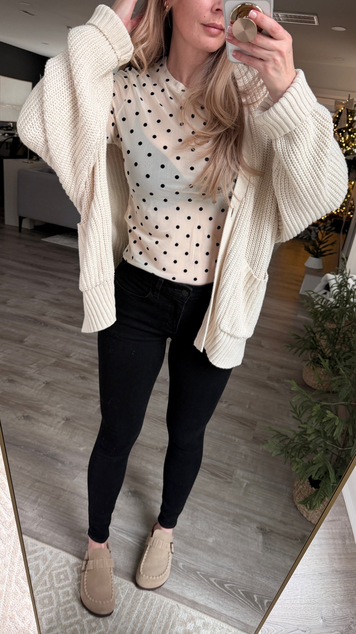 Fall outfit idea pairing this oversized cable knit cardigan with the cutest sheer polka dot top, favorite high waist jeans and suede clogs. Perfect look for date night, clean girl style with a sprinkle of flirty and edgy vibes yet still a casual outfit. 

Mesh top, sheer tops, winter outfit idea, Christmas party outfit, fall nails, suede shoes, Birkenstock clogs, the look for less, best bra, t-shirt bra, black and white outfit casual holiday outfit 

#LTKmomlife #LTKHoliday #LTKootd