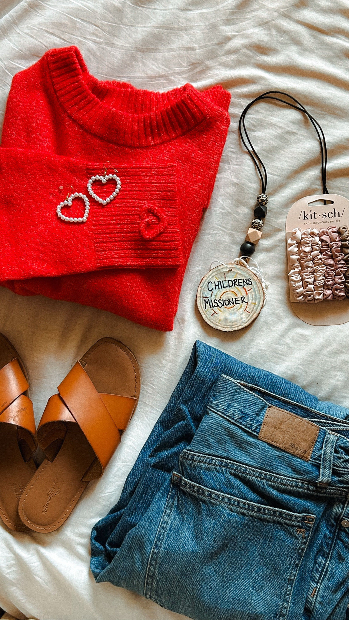 So proud of December Lauren for thinking ahead and packing the perfect sweater for Valentines Day next month before I came to Kenya! Loving how this bright red is the perfect pairing to my “uniform” — my go-to Madewell jeans and these comfy sandals. 💕 

#LTKSeasonal #LTKMidsize #LTKTravel