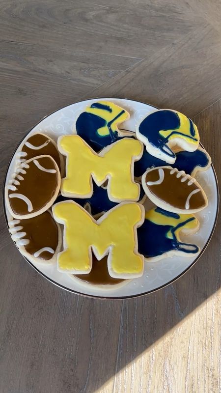 Michigan cookies for the game! Linking the exact cookie cutters I used for the footballs and helmets. Michigan wolverines. University of Michigan. Football cookies. Sugar cookies. 

#LTKunder50 #LTKSeasonal