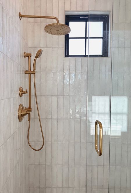 Moen rain shower head and handheld combo. Collinet collection✨ if adding the handheld you will need the elbow piece which is linked as well. I have also linked the sink faucet to match. We have the cross handles on the faucet. 

Gold shower trim. Gold rain shower. Moen trim. 