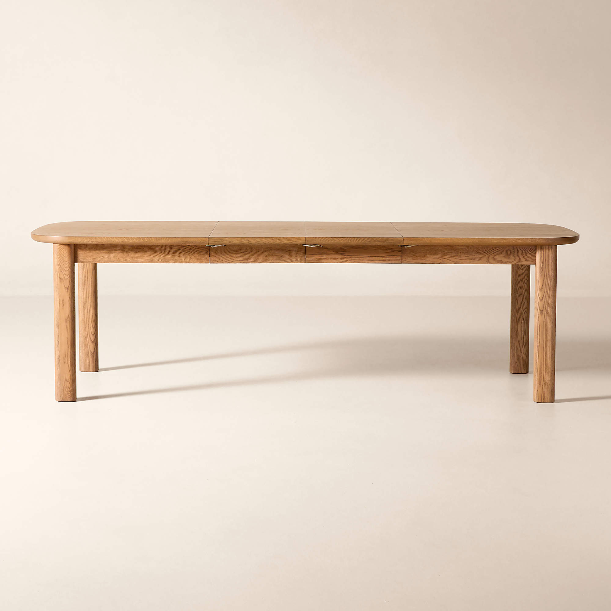 Langley 66"-100" Rectangular Oak Extendable Dining Table + Reviews | CB2 | CB2