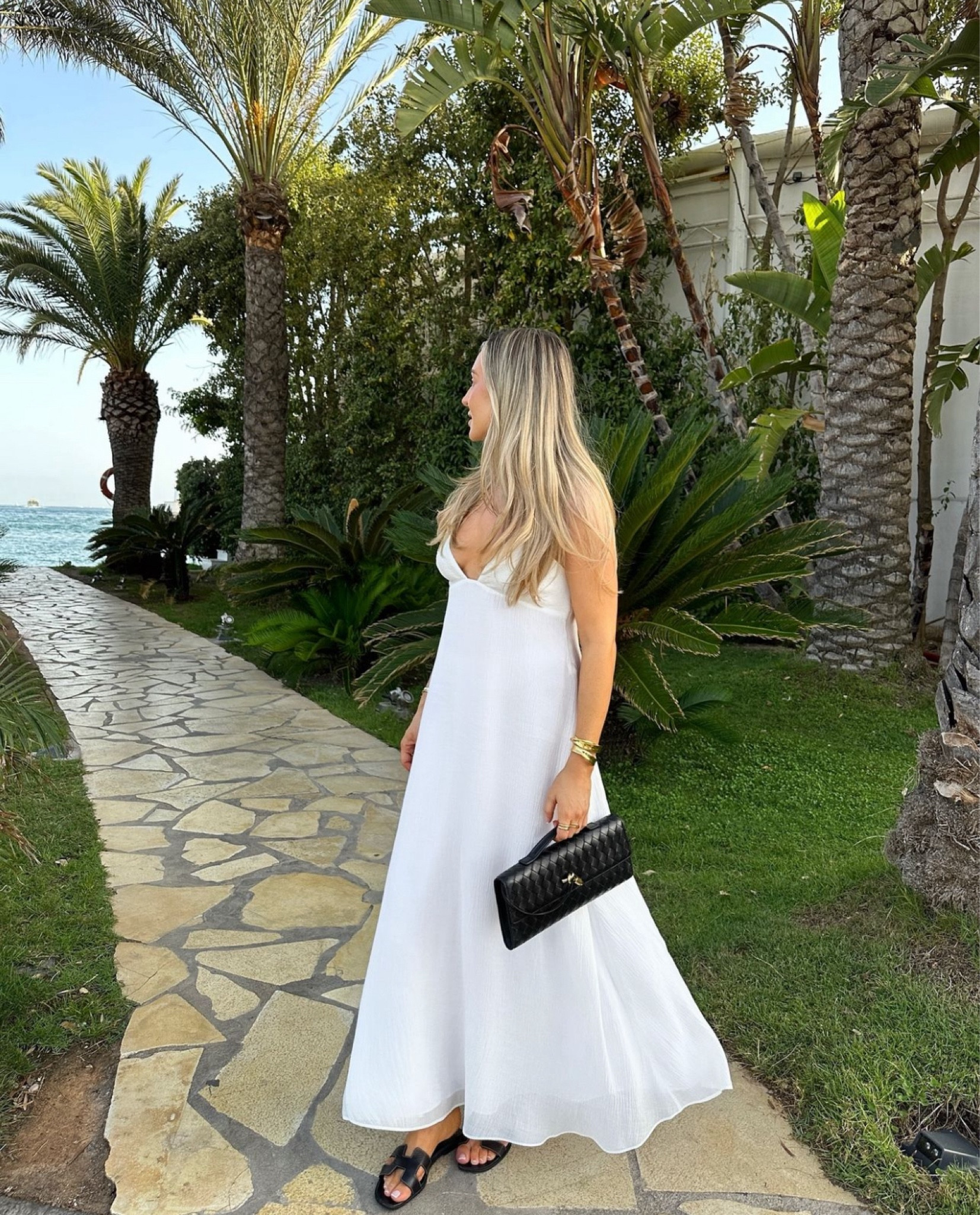 Ultimate summer evening look, white floaty maxi dress from Zara with black and gold accessories 

#LTKluxury #LTKeurope #LTKsummer