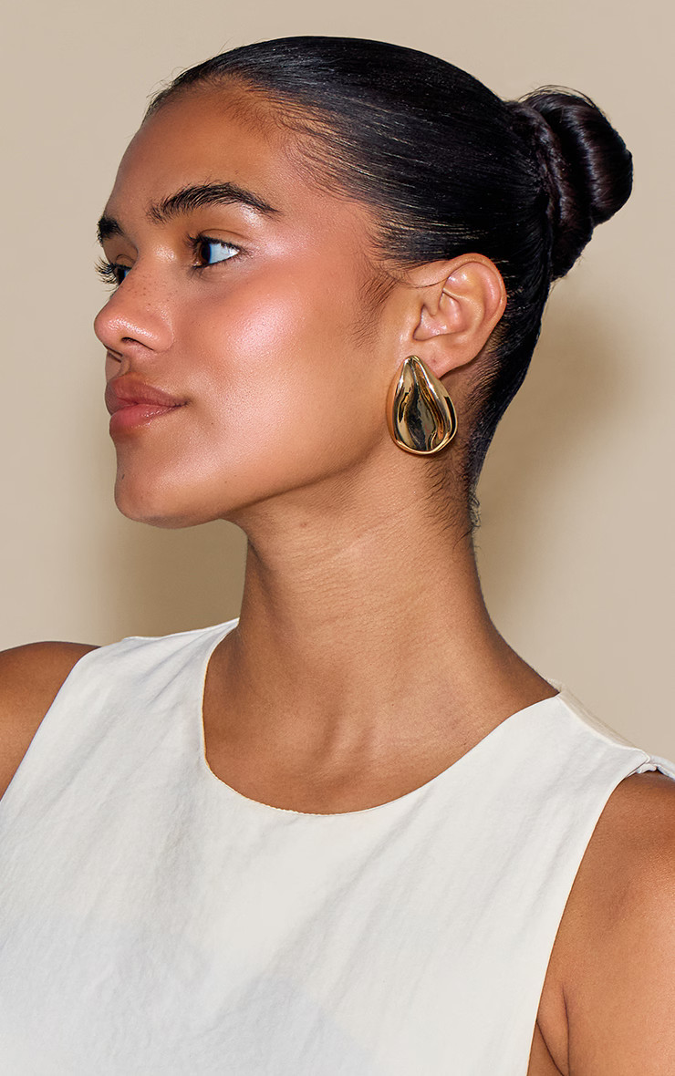 Gold Sculpted Tear Drop Oversized Stud Earrings | Accessories | PrettyLittleThing UK