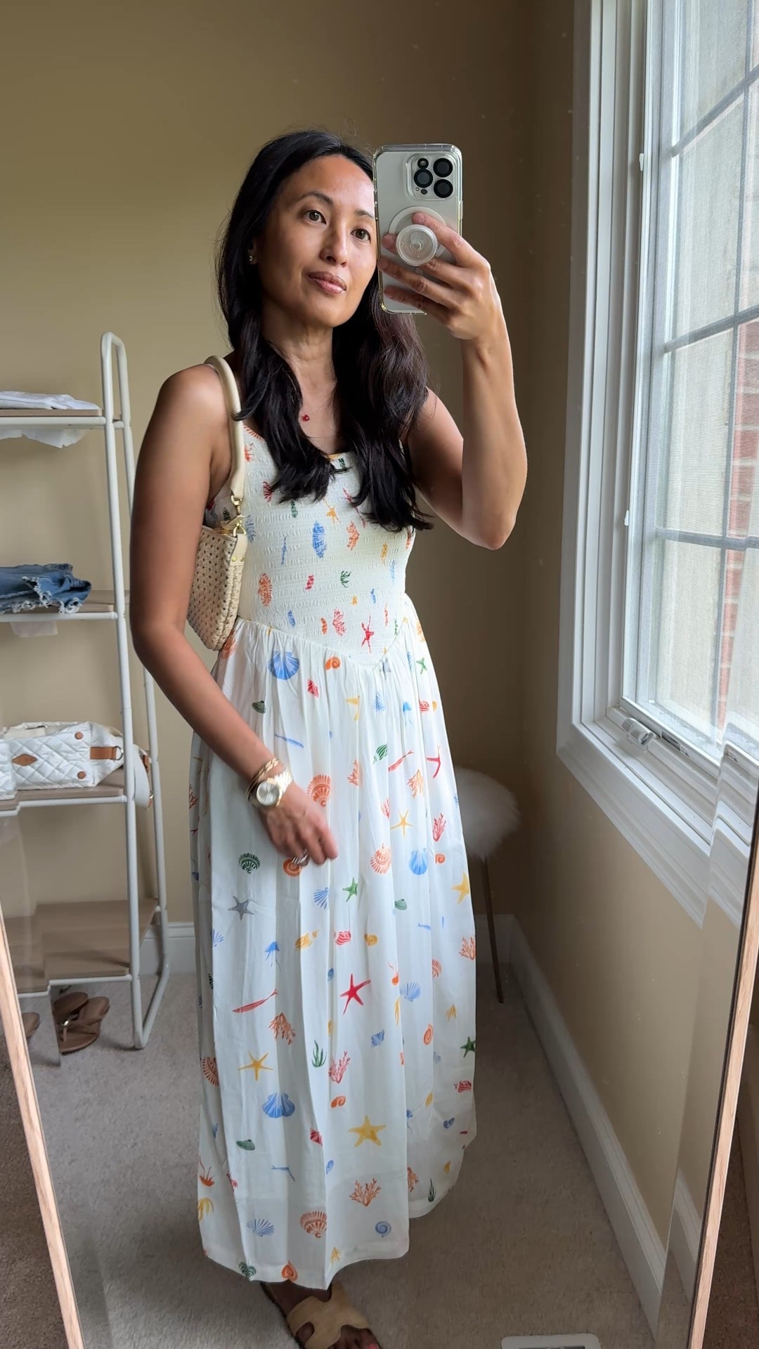 Simple beach vacation outfit inspo. 
Easy breezy dress, slide sandals, woven bag, delicate necklace with a pop of color. 
- Exact dress looks boutique-y, but is $35. Lined, adjustable straps, stretchy bodice. Comes in multiple colors. I love this beach themed print. True to size. 
- Slide sandals with designer style; $20. 
- Small heart pendant in red makes a nice little statement.  Linking options  
- Woven bag comes with 2 straps. 


#LTKTravel #LTKOver40 #LTKFindsUnder50