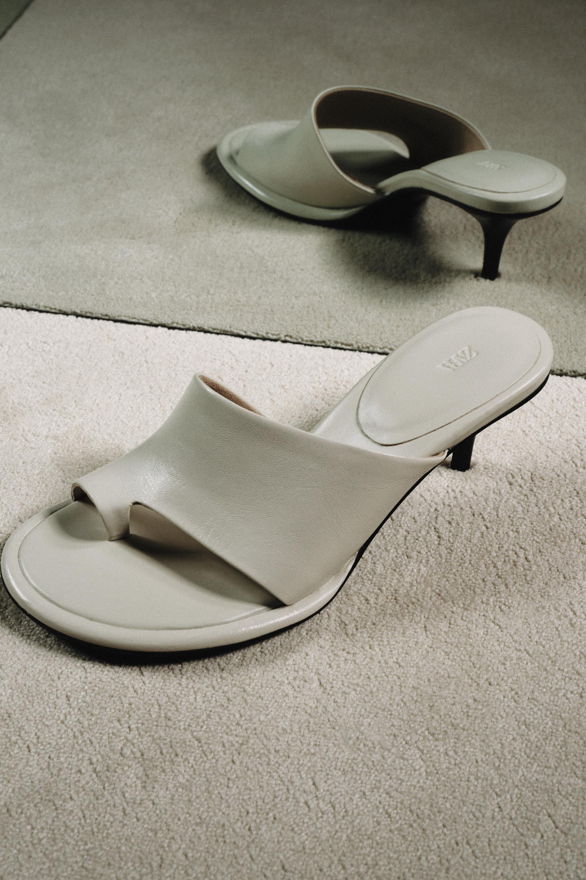 Leather heeled sandals. Mule style. Asymmetrical strap with a toe post detail at the front. High ... | Zara US