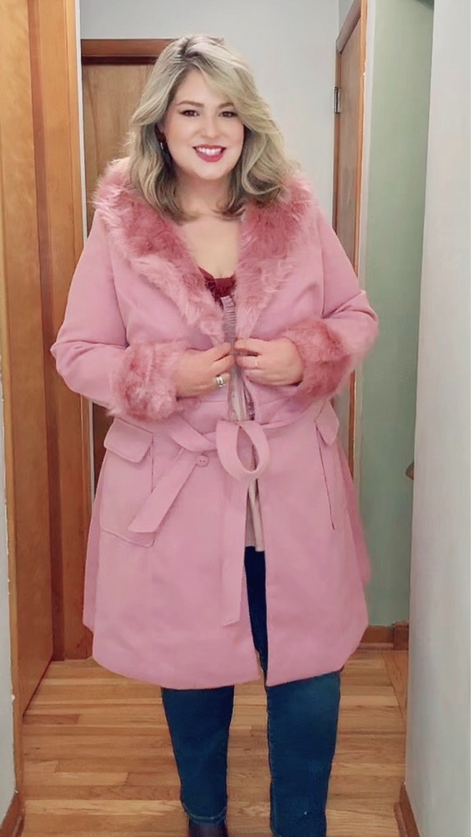 Fun statement outfit for a night out with friends 💕 
Wearing a bow-detail top styled with classic denim, red heels, and a pink faux-fur trimmed coat for a feminine, elevated look. Perfect for midsize women who love playful details with polished layers.